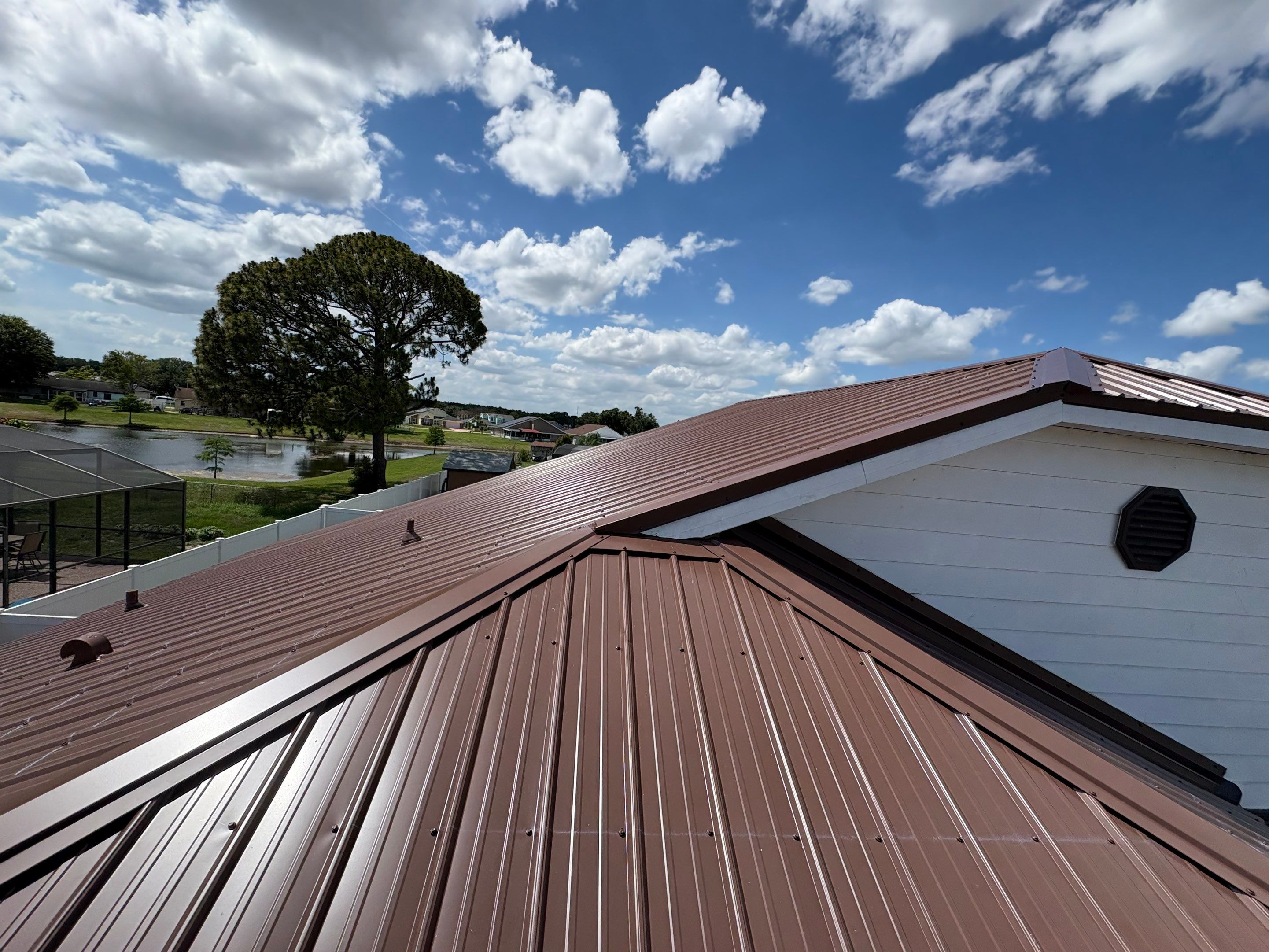Residential Metal Roofing Installation and Gutter Replacement in Kissimmee by Pinnacle Roofing Group