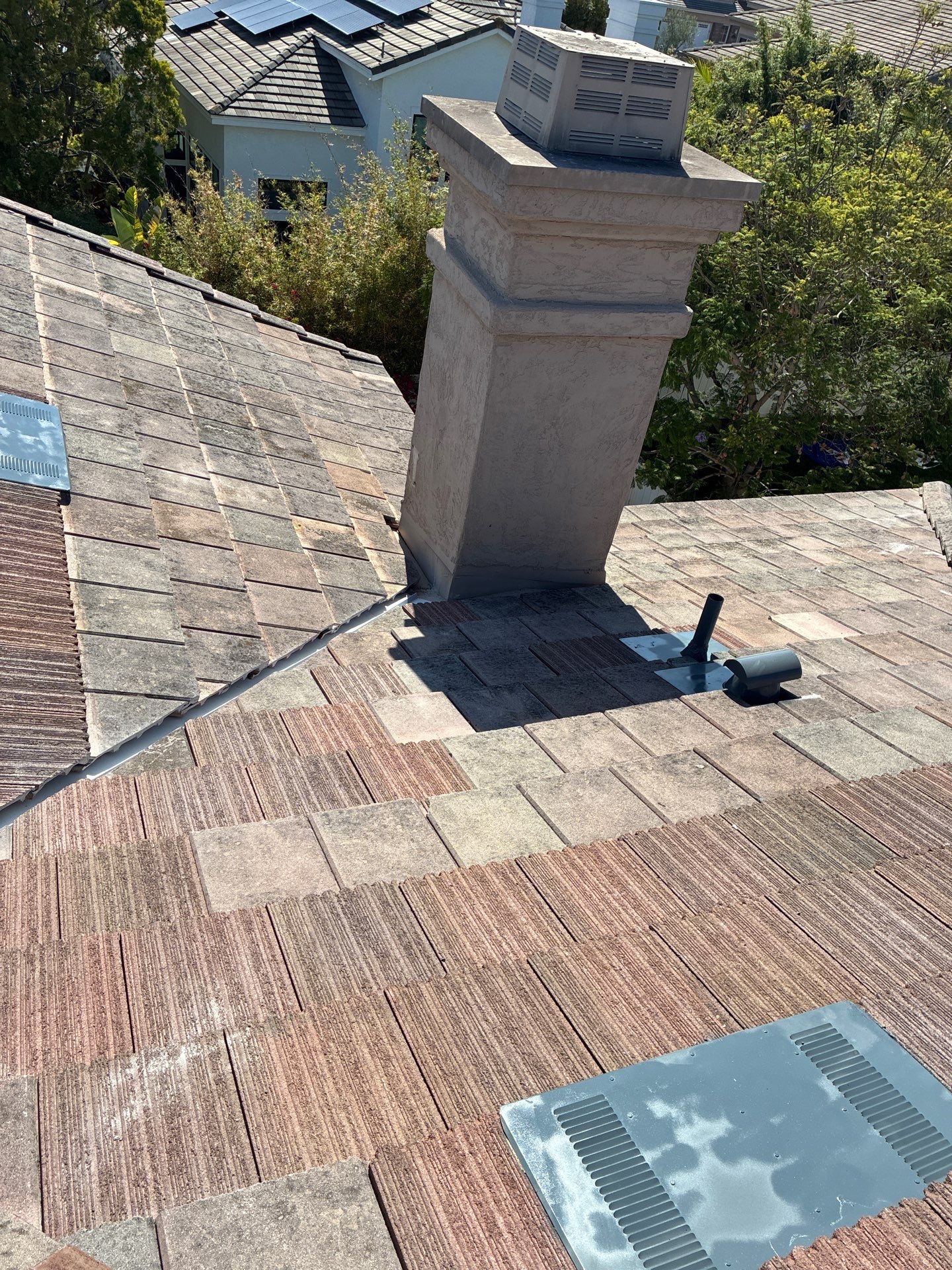 Carlsbad Concrete Tile Roof Replacement with Copper Flashing and Skylights by Reliable Roofing San Diego Inc.