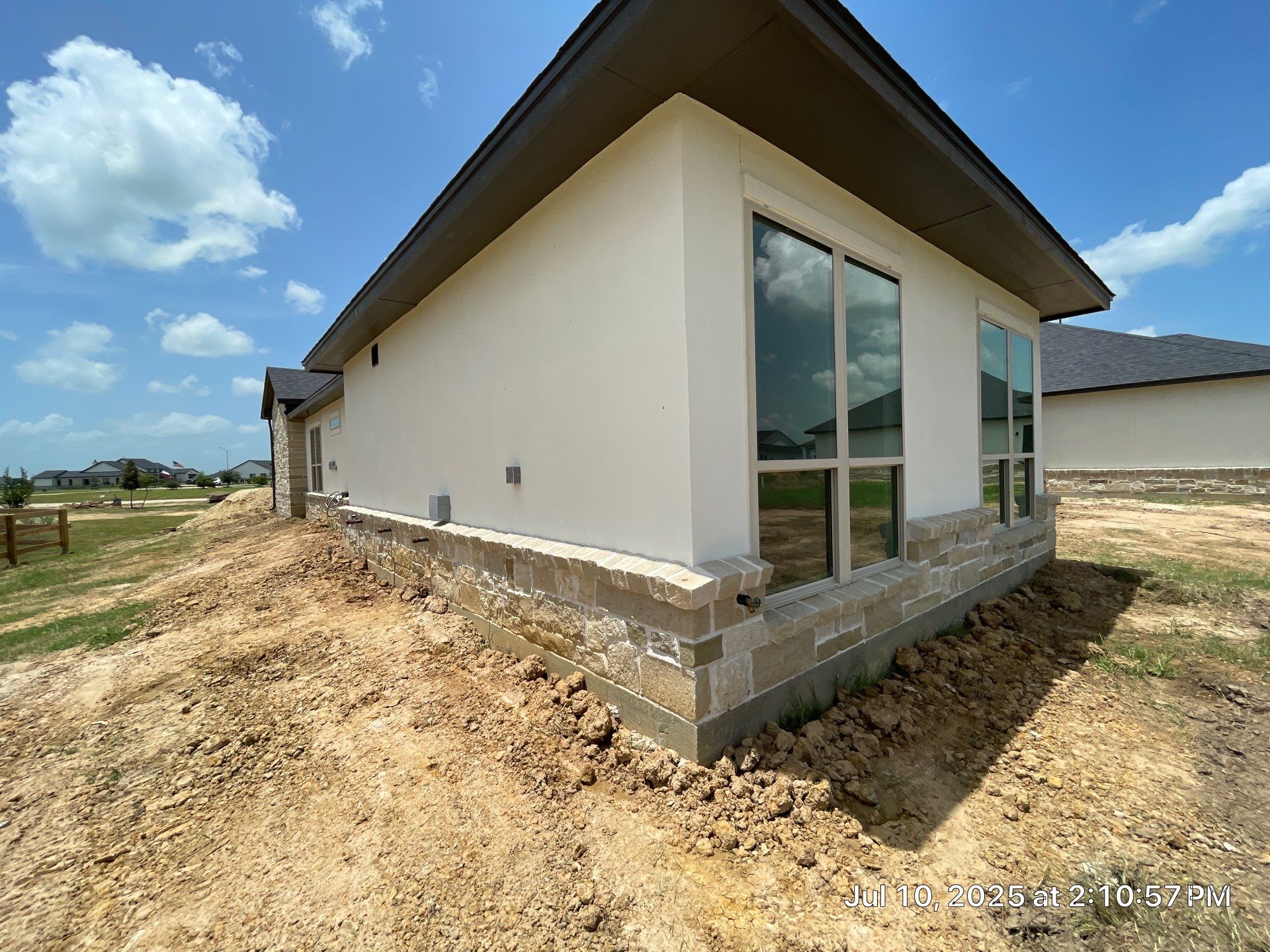 Waller Estate Elegance: Apex Stucco with Grand Stone Accents by Apex Conventional Stucco Llc