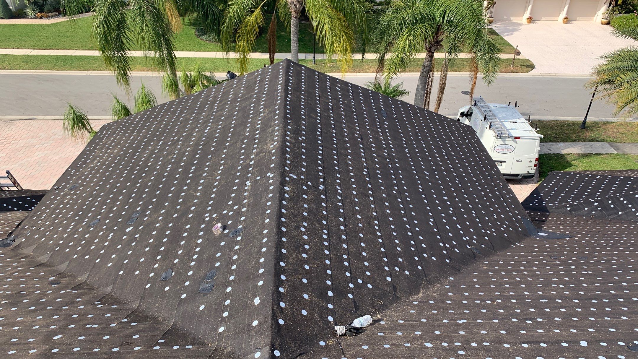 Residential Roofing Installation using 1" Nail strip metal roof by BLUES BROTHERS CONSTRUCTION CORP
