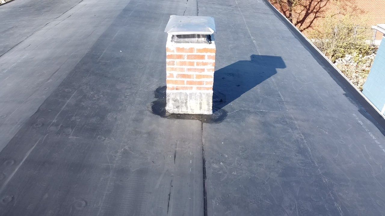 Residential Rubber Roofing -2 Story Home  by Delarosa Construction & Design