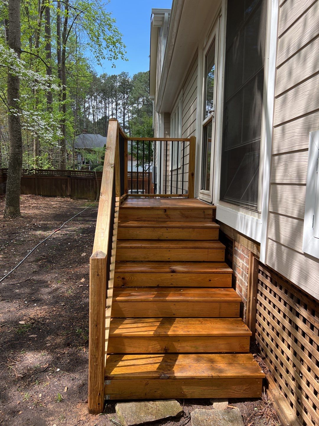 Deck and Stamped Concrete Patio by DuraSeal