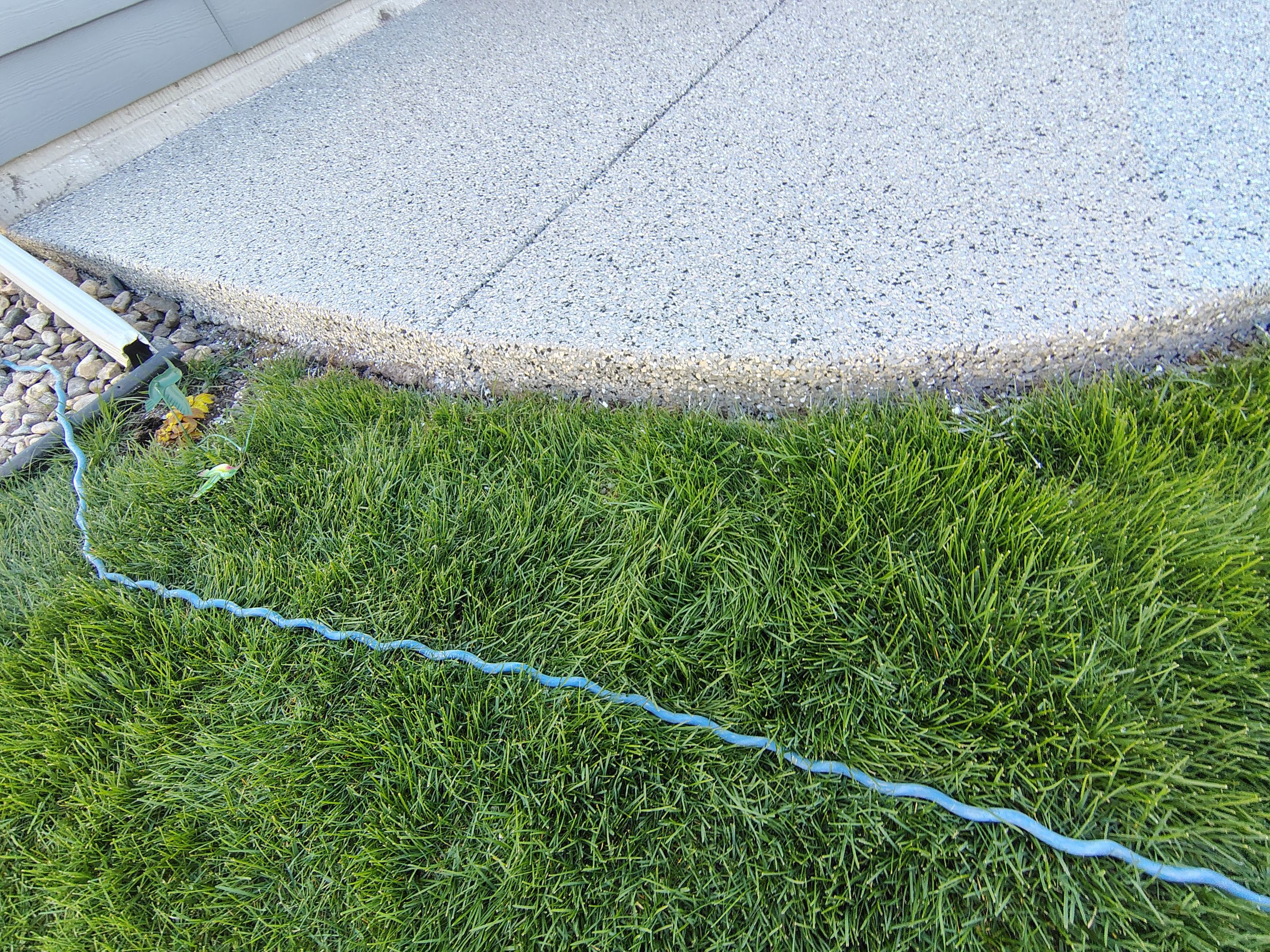 Speckled Concrete Patio Coating Installation in Sioux Falls by Select Painting, Coatings & Garage Cabinets