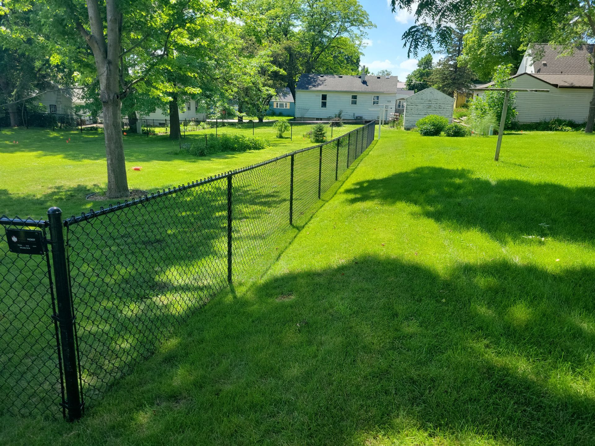 Black Chain Link Perimeter Fence and Driveway Gate in Waverly by Perfect Picket Fence and Stain