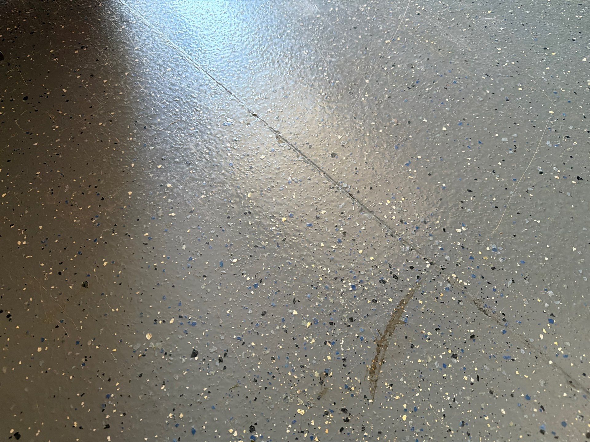 Multi-Car Garage Concrete Coating with Coyote Flake Finish in Sioux Falls by Select Painting, Coatings & Garage Cabinets