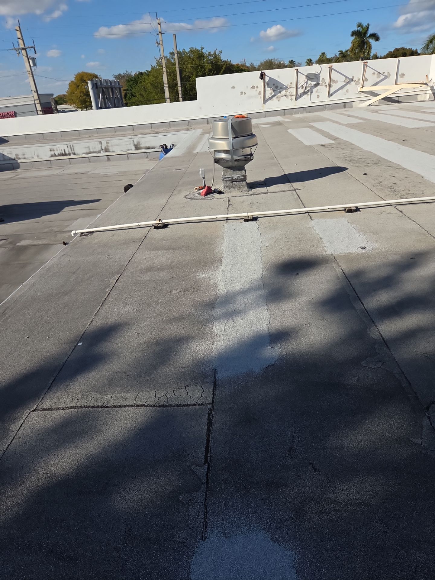 Commercial Flat Roof Restoration Using Silicone Coating in Hallandale Beach by Aastro Roofing