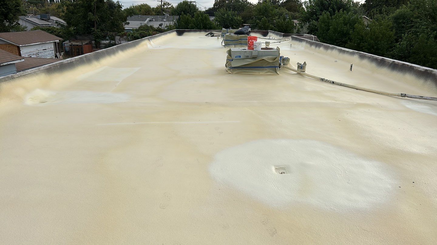 Foam Refurbish using Conklin Benchmark/PUMA XL coatings and spray foam; Also metal roofing around parapet wall by Straight Edge Roofing Inc