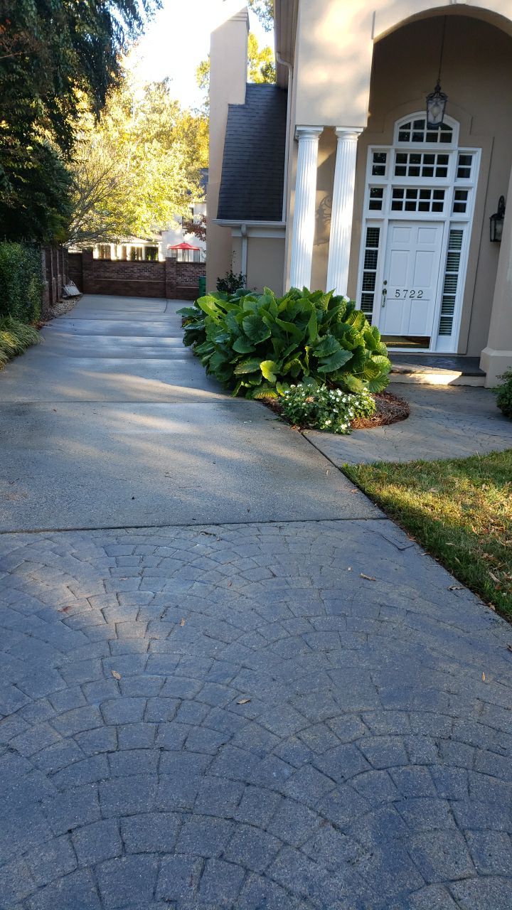 Driveway Clean using cleaner by Power Wash Masters LLC