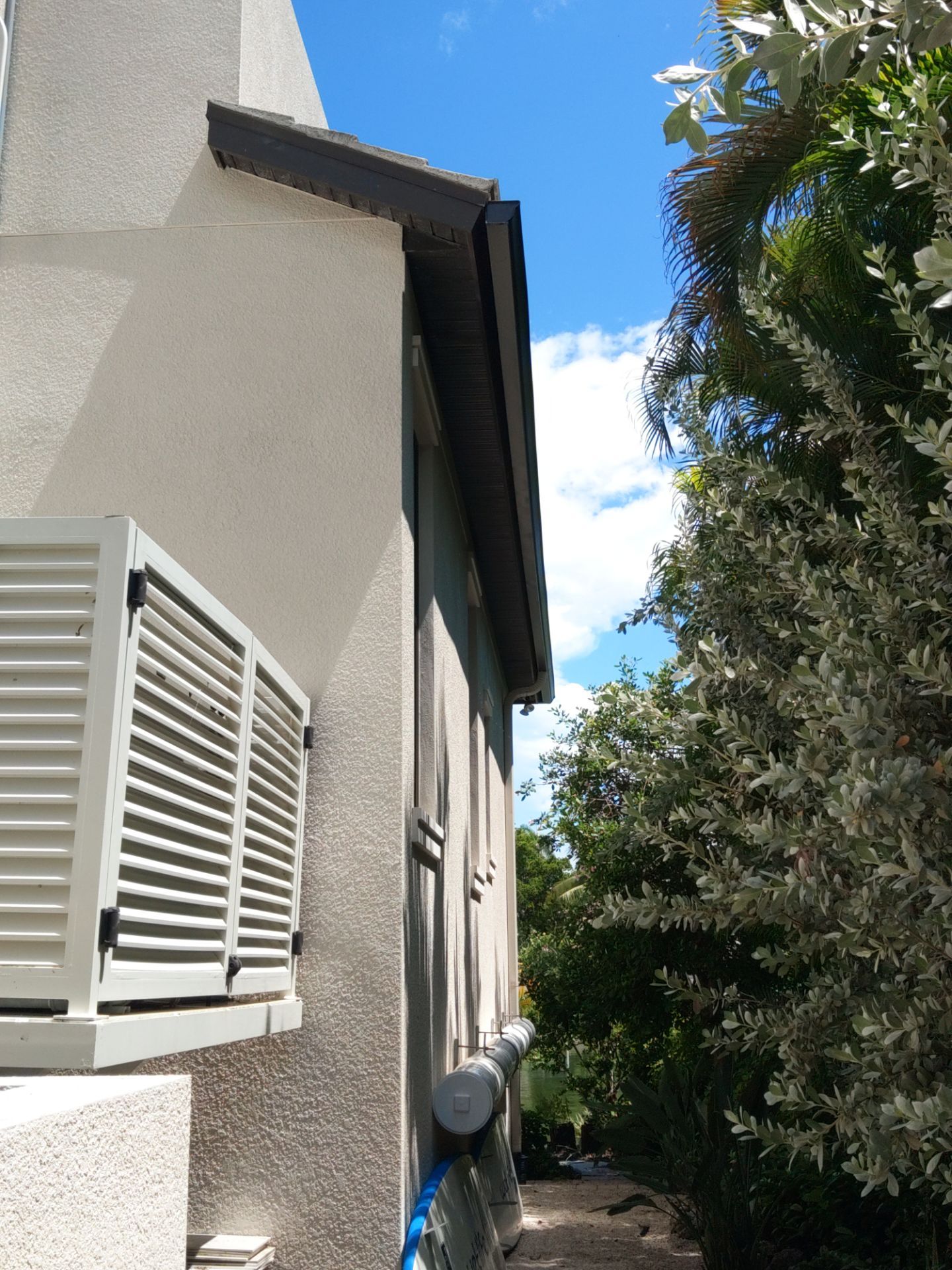 Bronze Gutters and Almond Downspouts in Longboat Key FL by Gutter Professors