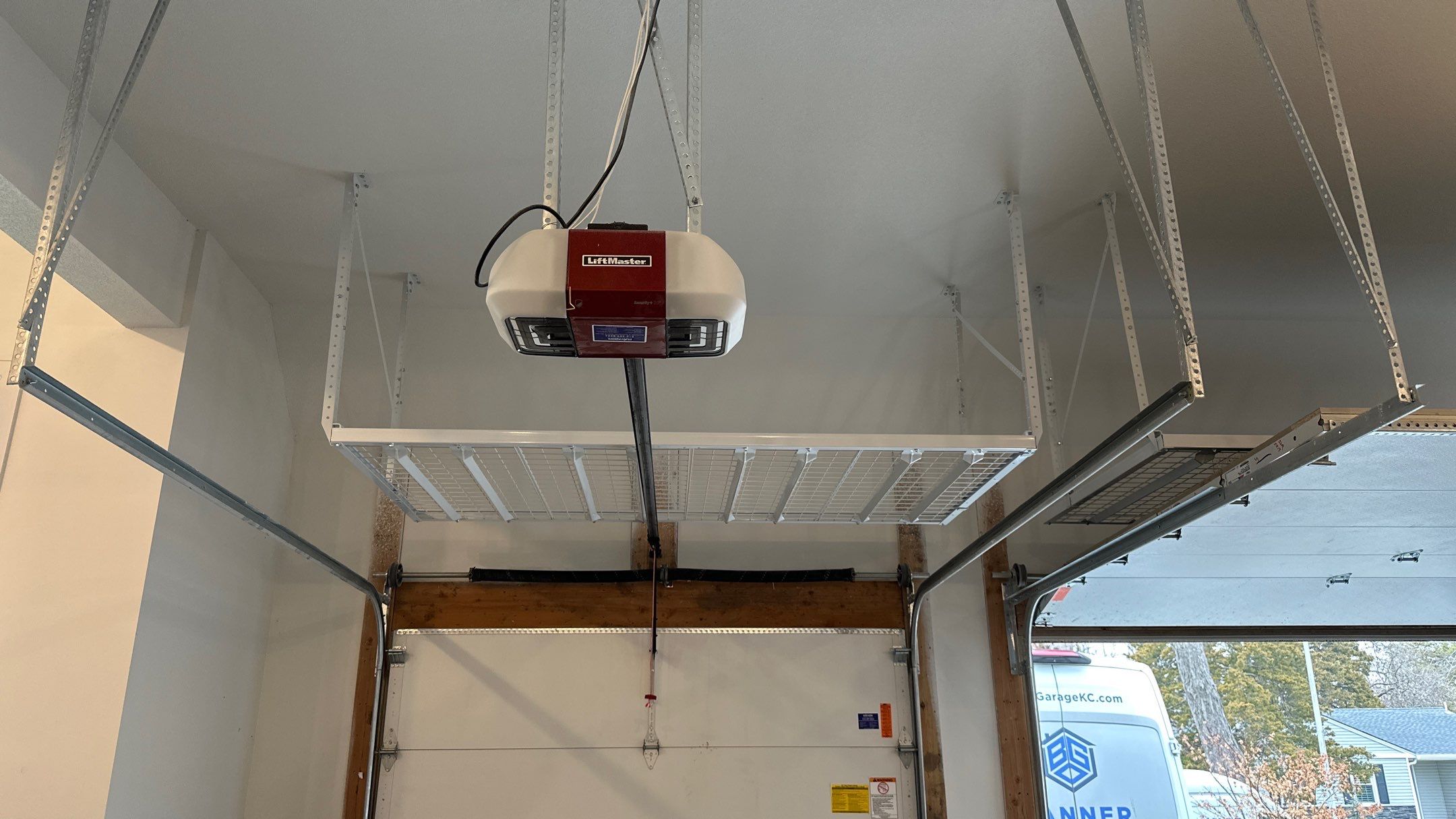 Max R. upgraded his garage with overhead racks and a New floor  by Banner Garage