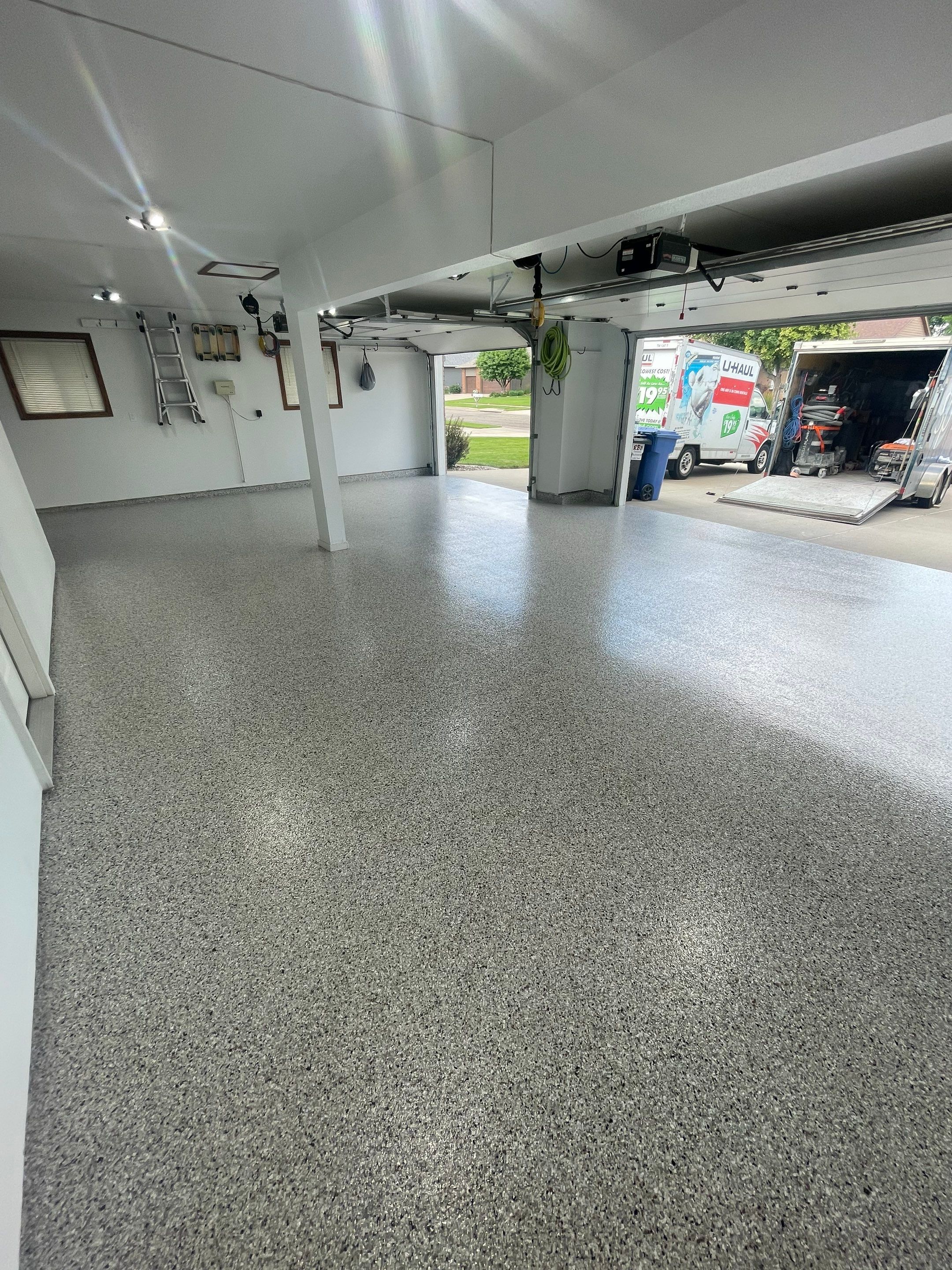 Multi-Car Garage Concrete Coating with Coyote Flake Finish in Sioux Falls by Select Painting, Coatings & Garage Cabinets