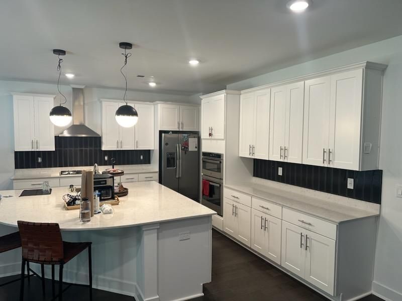 New build Kitchen Backsplash by Footprints Floors Morristown