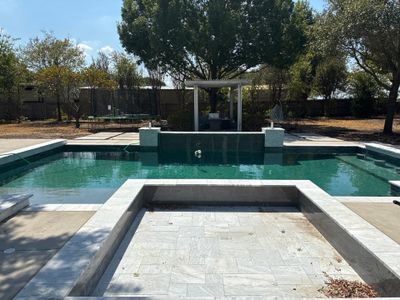 Modern Geometric Pool with Raised Spa and Sun Ledge