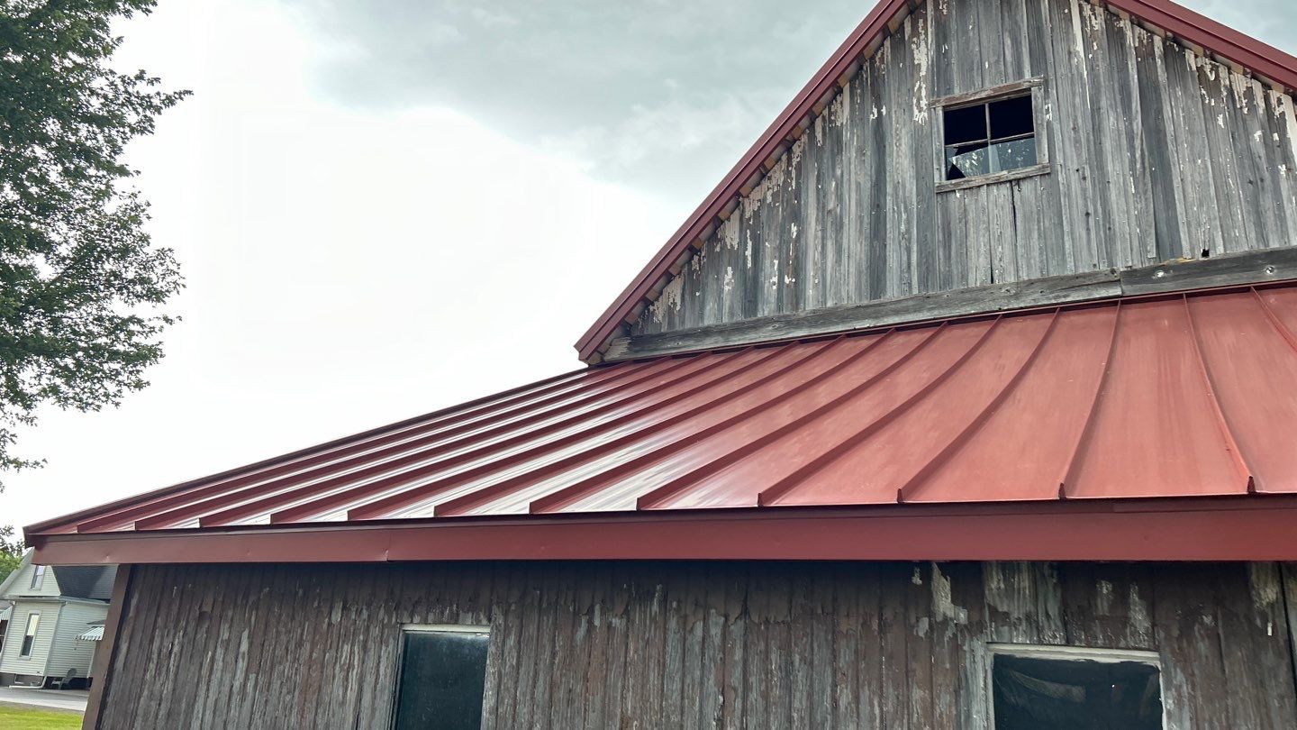 Residential Roofing Installation using Standing Seam Metal - Barn Red by RoofX 