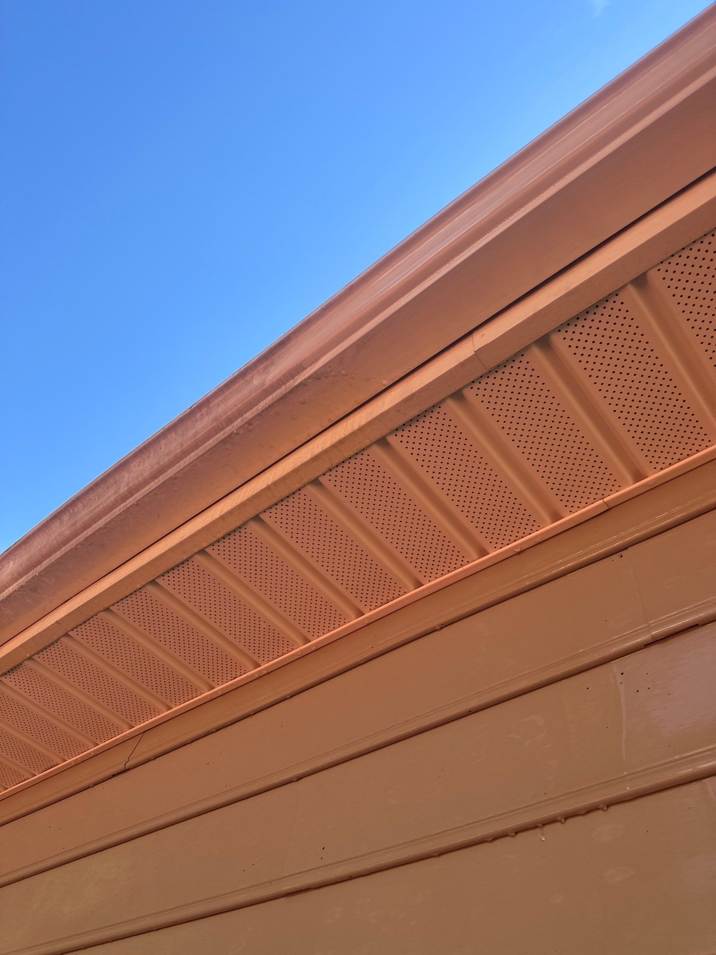 cleaning of the soffit and fascia surfaces to remove dirt and debris for improved appearance and maintenance