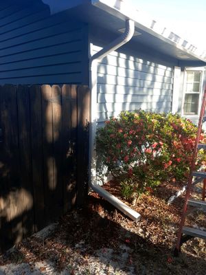 Seamless Gutter Installation Using White K-Style Gutters 