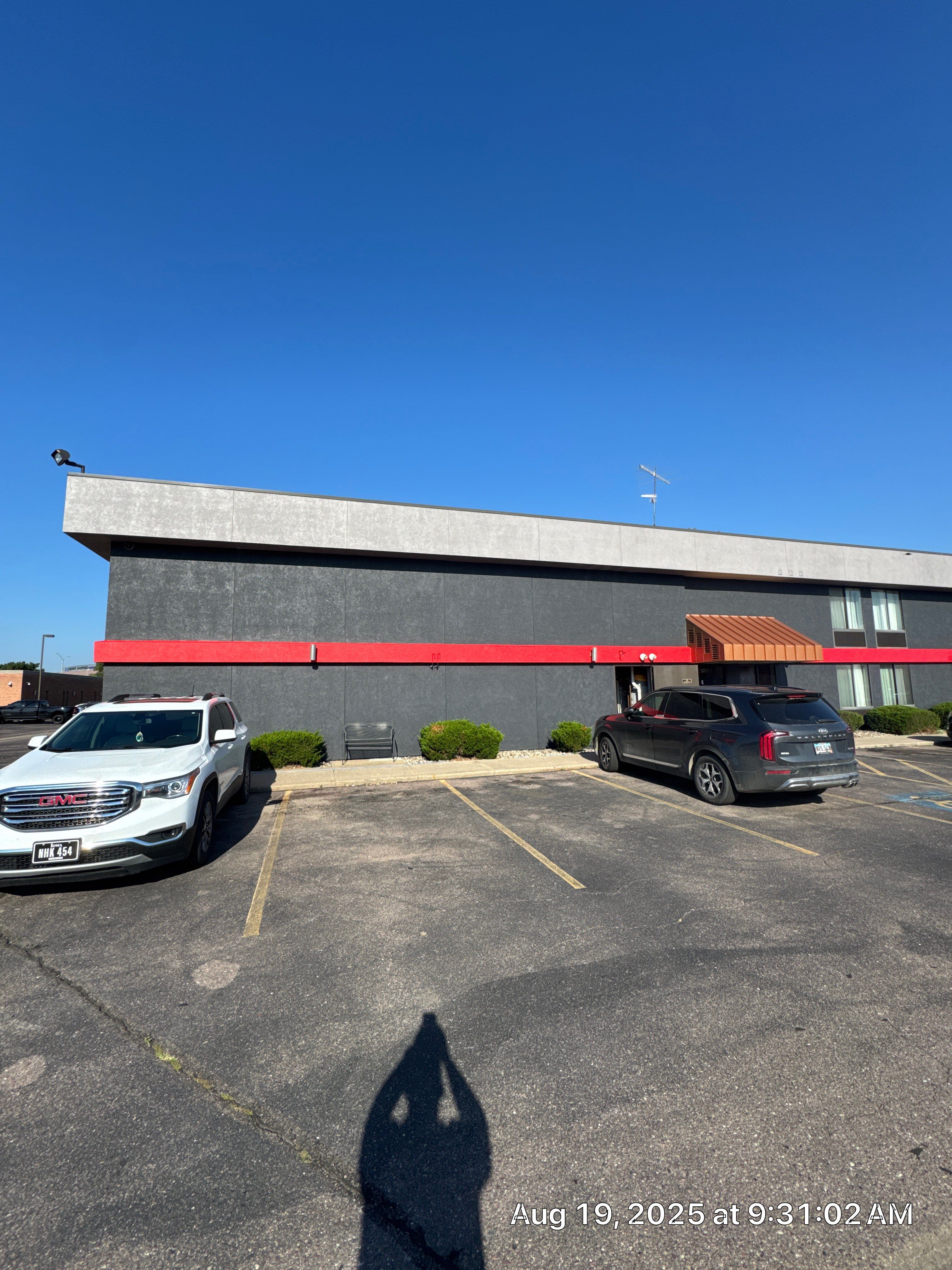 Commercial Exterior Painting with Stucco and Bold Red Accent Trim by Select Painting, Coatings & Garage Cabinets