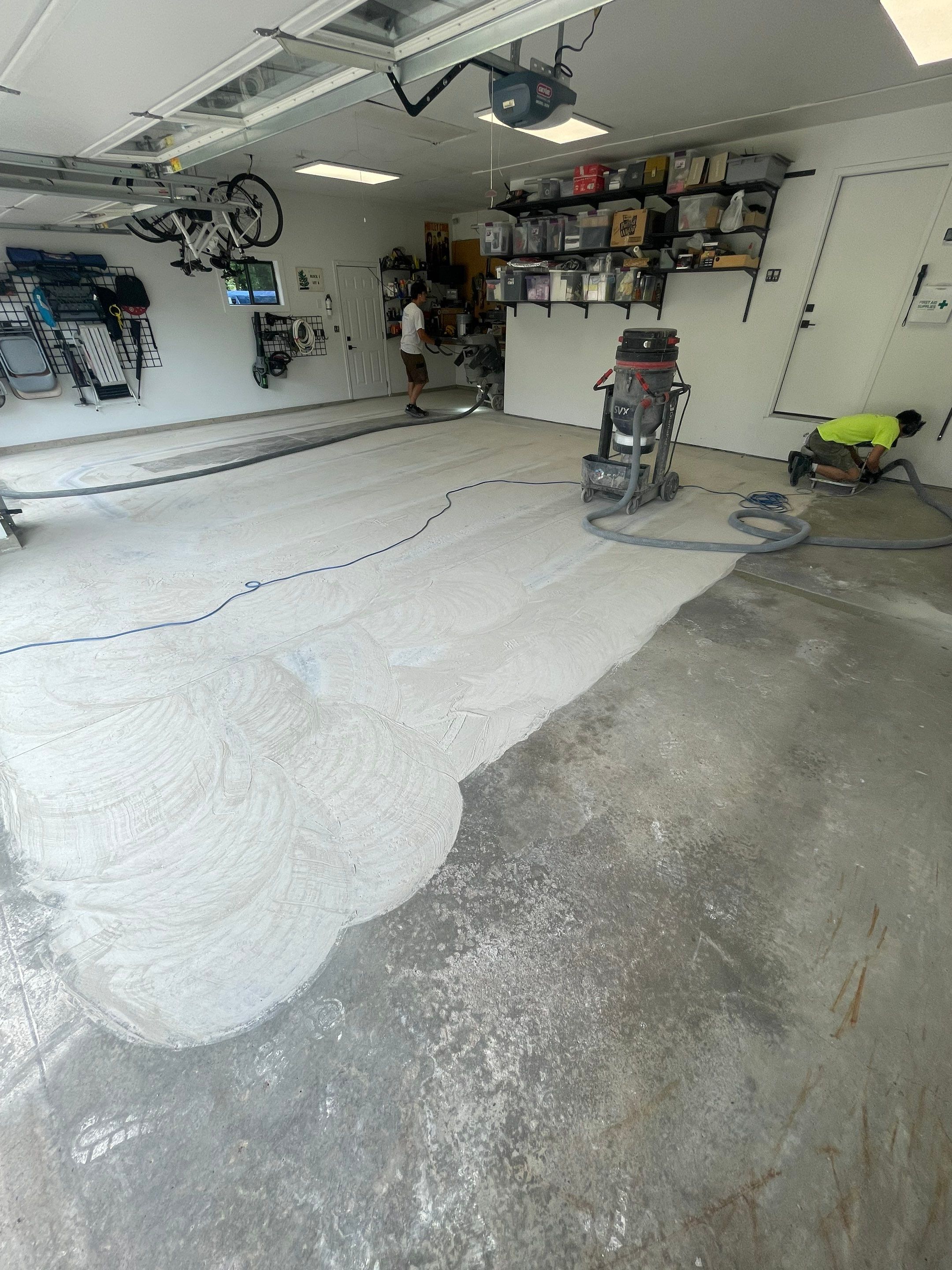 Feather Grey Garage Floor Coating Installation in Sioux Falls by Select Painting, Coatings & Garage Cabinets