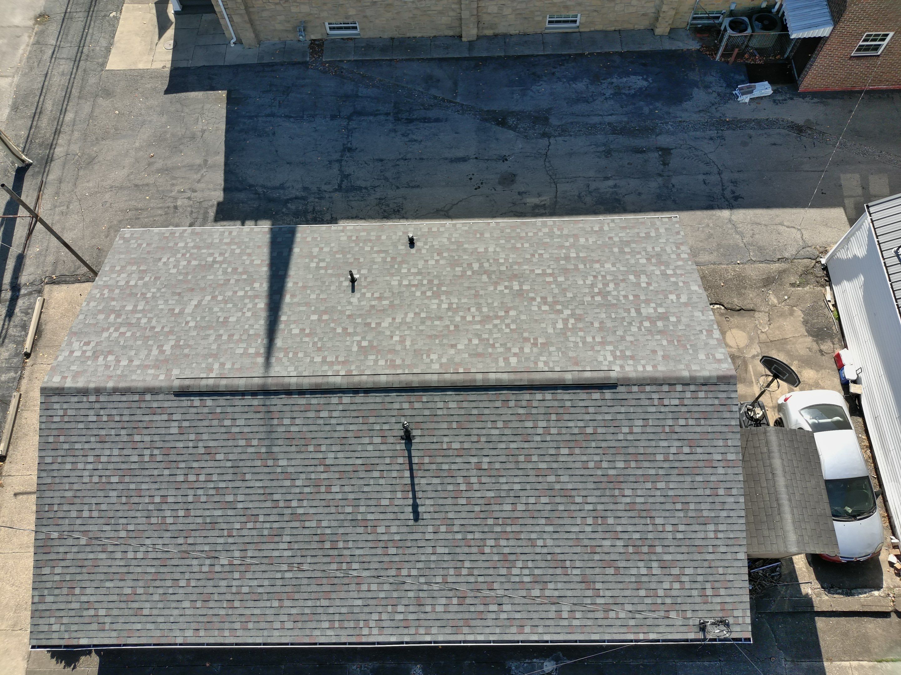 Commercial Roofing Installation using Performance Shingles by Mr. Roofer