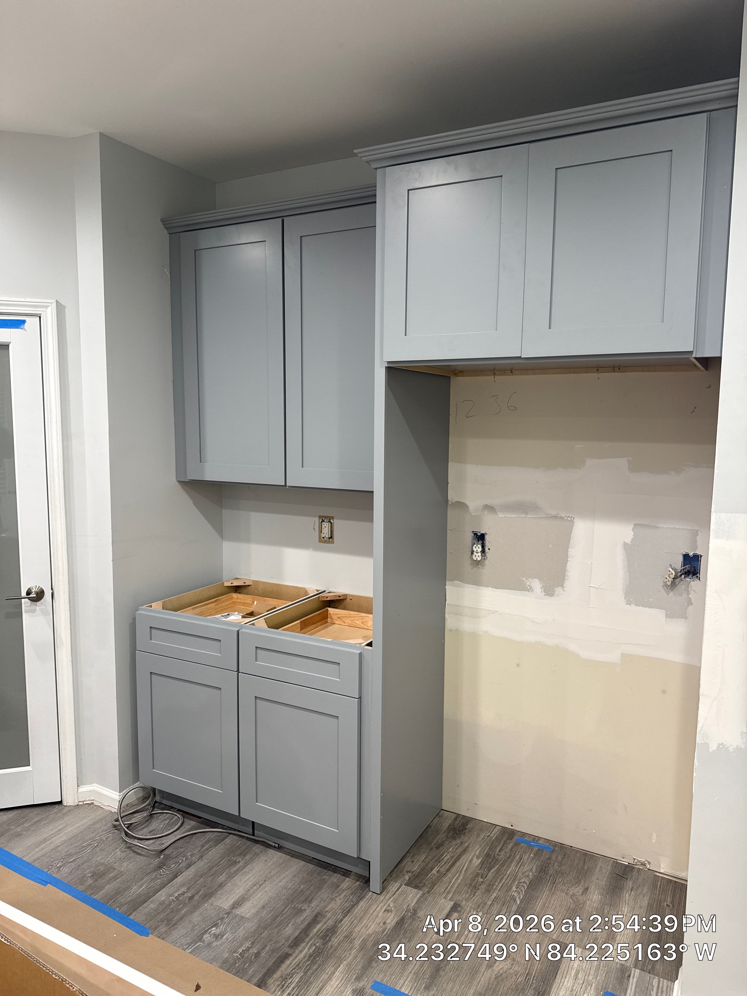 Modern Kitchen Remodel With Grey Shaker Cabinets and Navy Blue Island by Heart & Home Kitchen & Bath Remodeling LLC