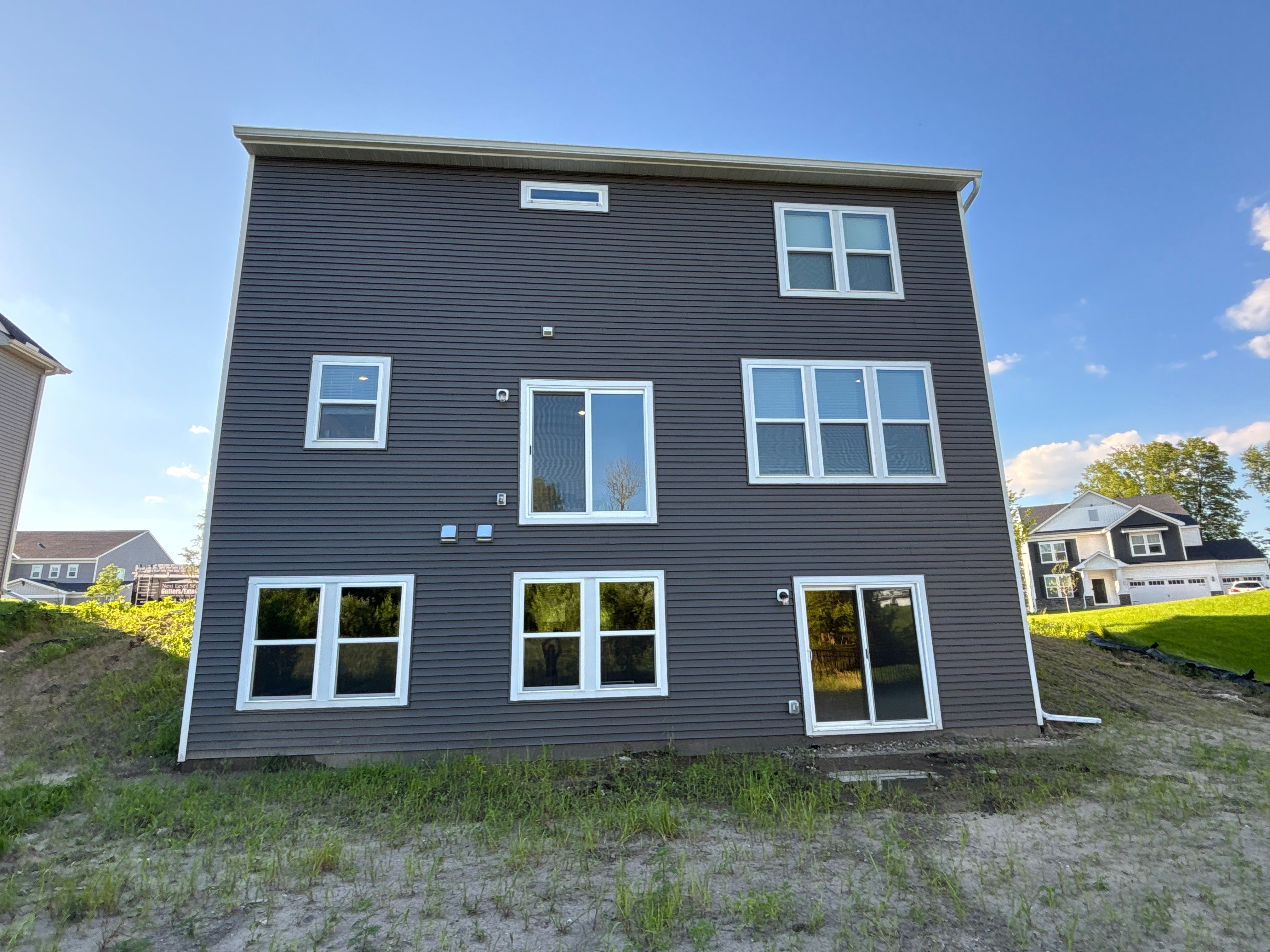 6" Seamless Gutters on 3-Story Home – Rogers, MN by Next Level Seamless Gutters / Exteriors Inc.