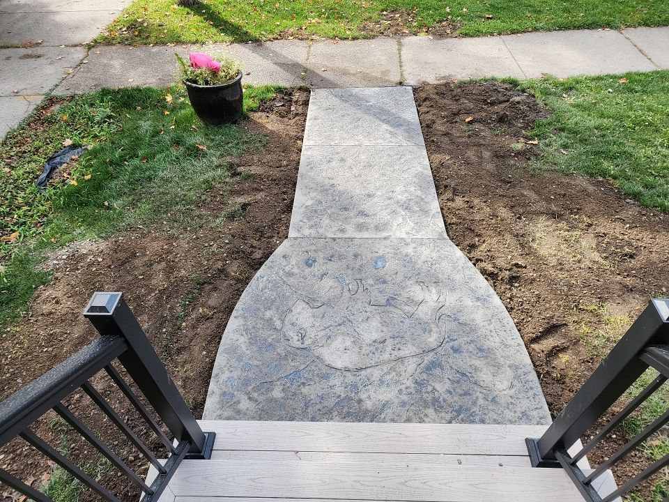 Exterior Renovations- Siding, Stamped Concrete, Porch, and Railings by Ivy Lea Construction