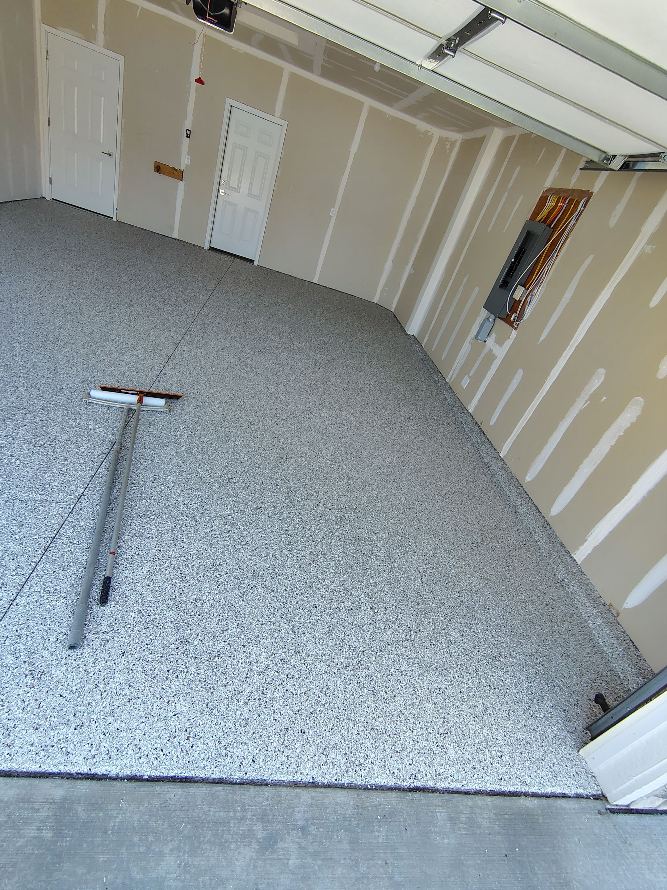Custom Epoxy Garage Floor and Patio Coating in Sioux Falls by Select Painting, Coatings & Garage Cabinets