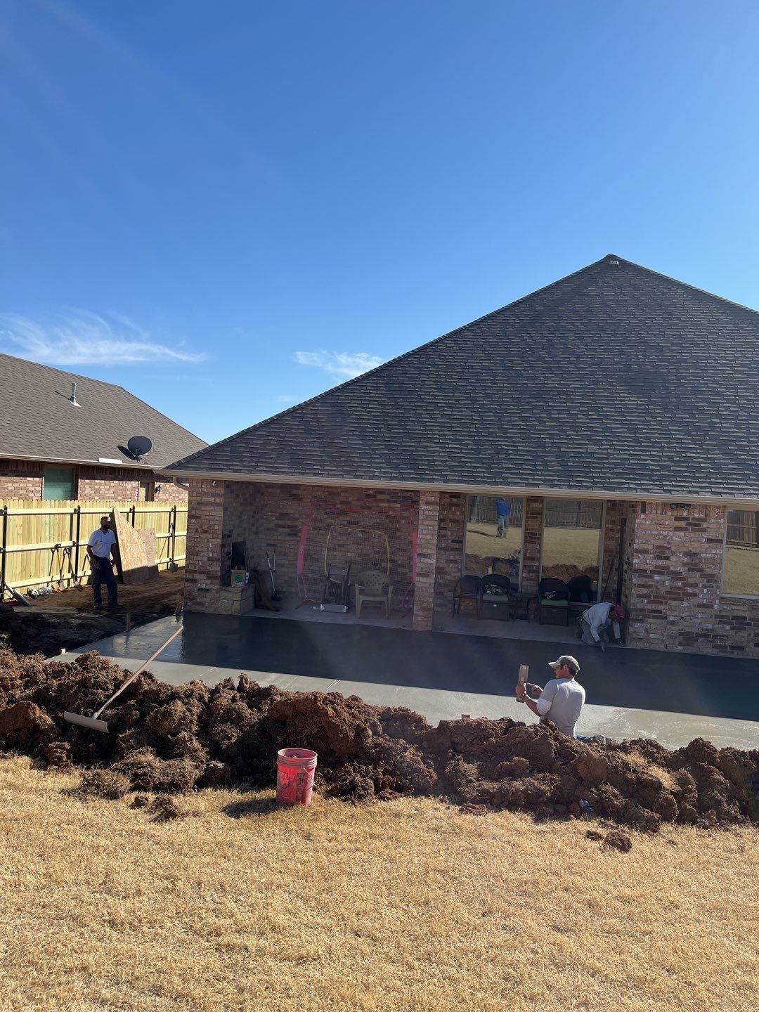 Concrete Slab , Retaining Wall , Fence, and landscape. by Clays Services Inc