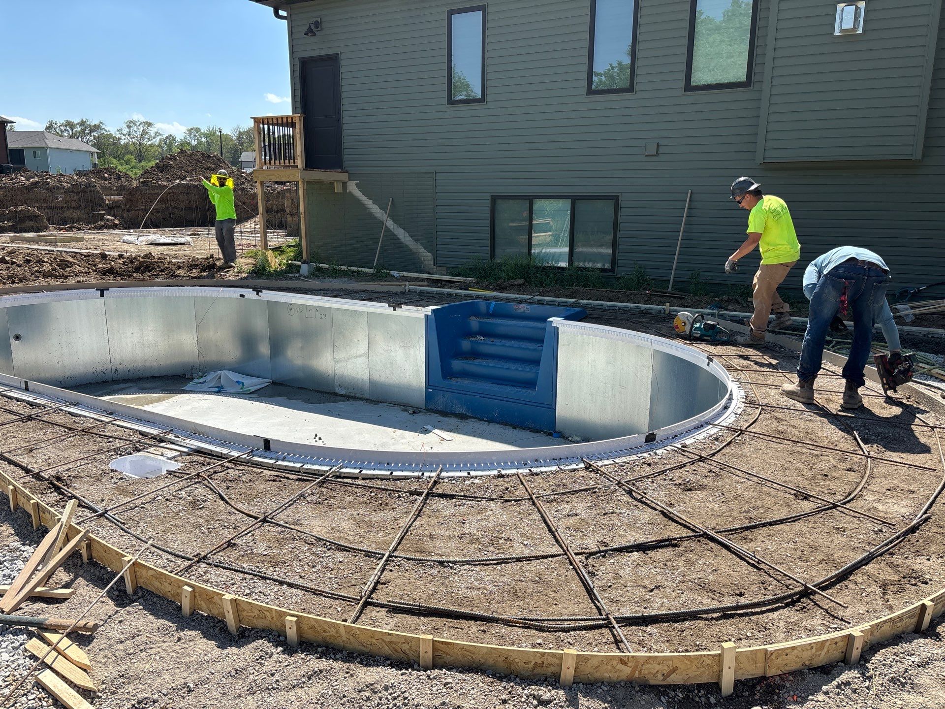 New Residential Construction - Paver, Putting Green, Pool by New Horizon Landscapes