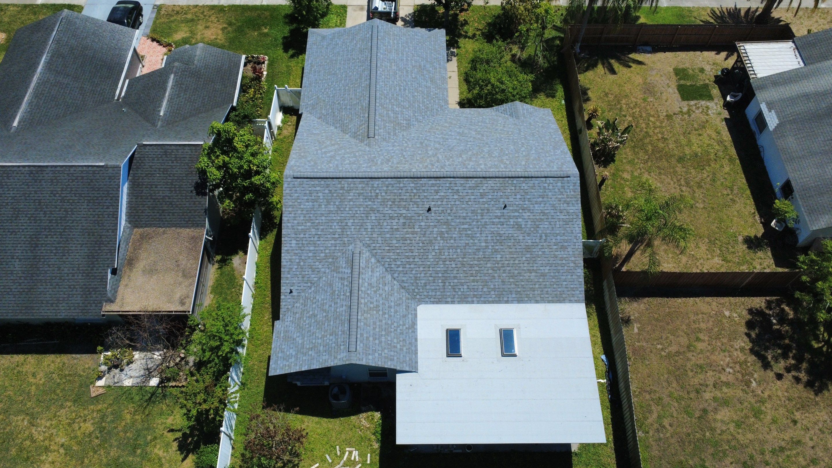 Owens Corning Shingle Roof Replacement and Skylight Upgrade in Tampa by Steadfast Roofing