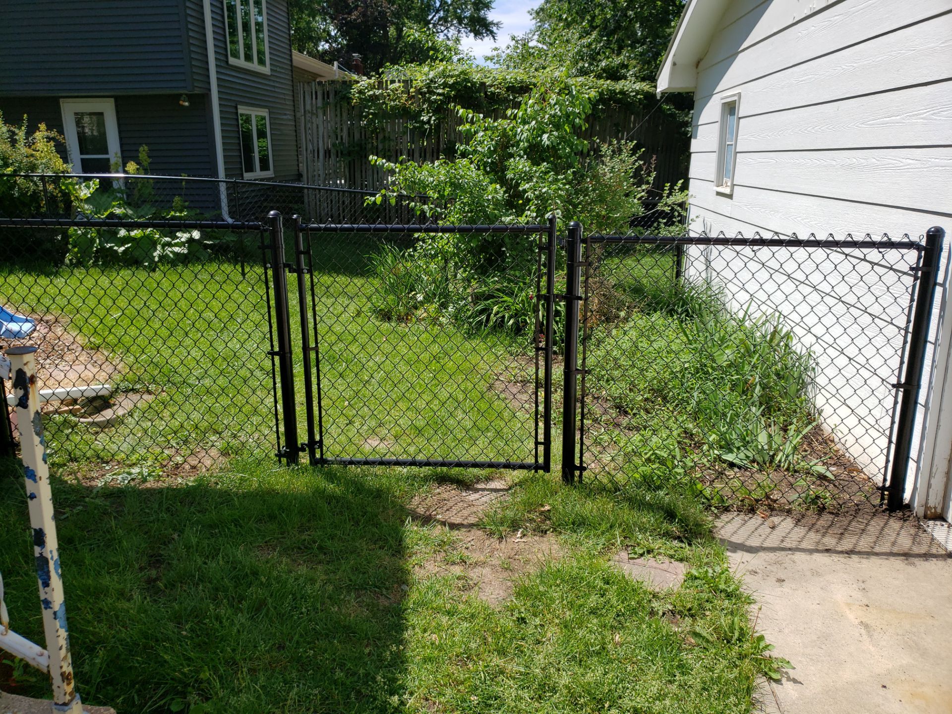 Black Chain Link Perimeter Fence and Gate Installation in Cedar Falls by Perfect Picket Fence and Stain