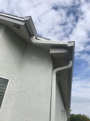 7-inch Grey Gutter Installation and White Downspouts in Fort Myers FL 