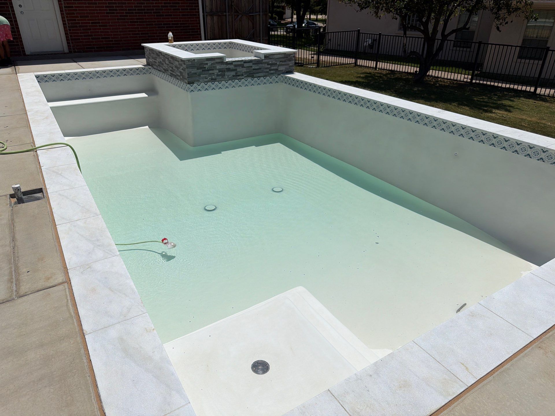 Geometric Pool with Raised Spa and Sun Shelf by Pinnacle Pools and Spas - DFW