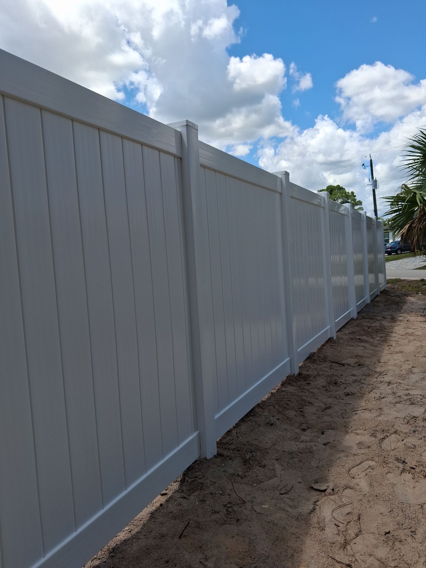 White Vinyl Privacy Fence Installation in North Port Florida by True Fence LLC