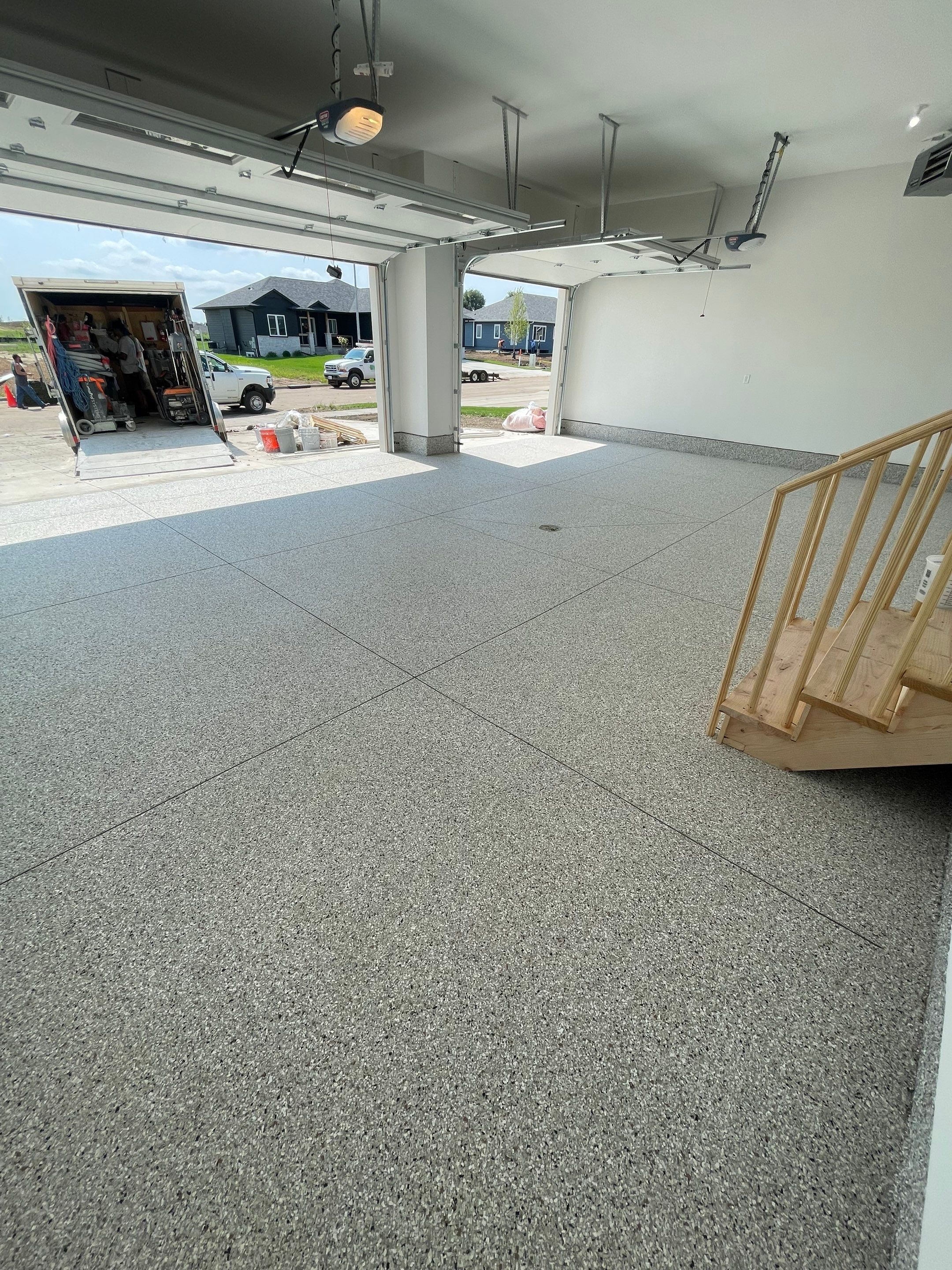 Grey Speckled Garage Floor Coating in Sioux Falls by Select Painting, Coatings & Garage Cabinets
