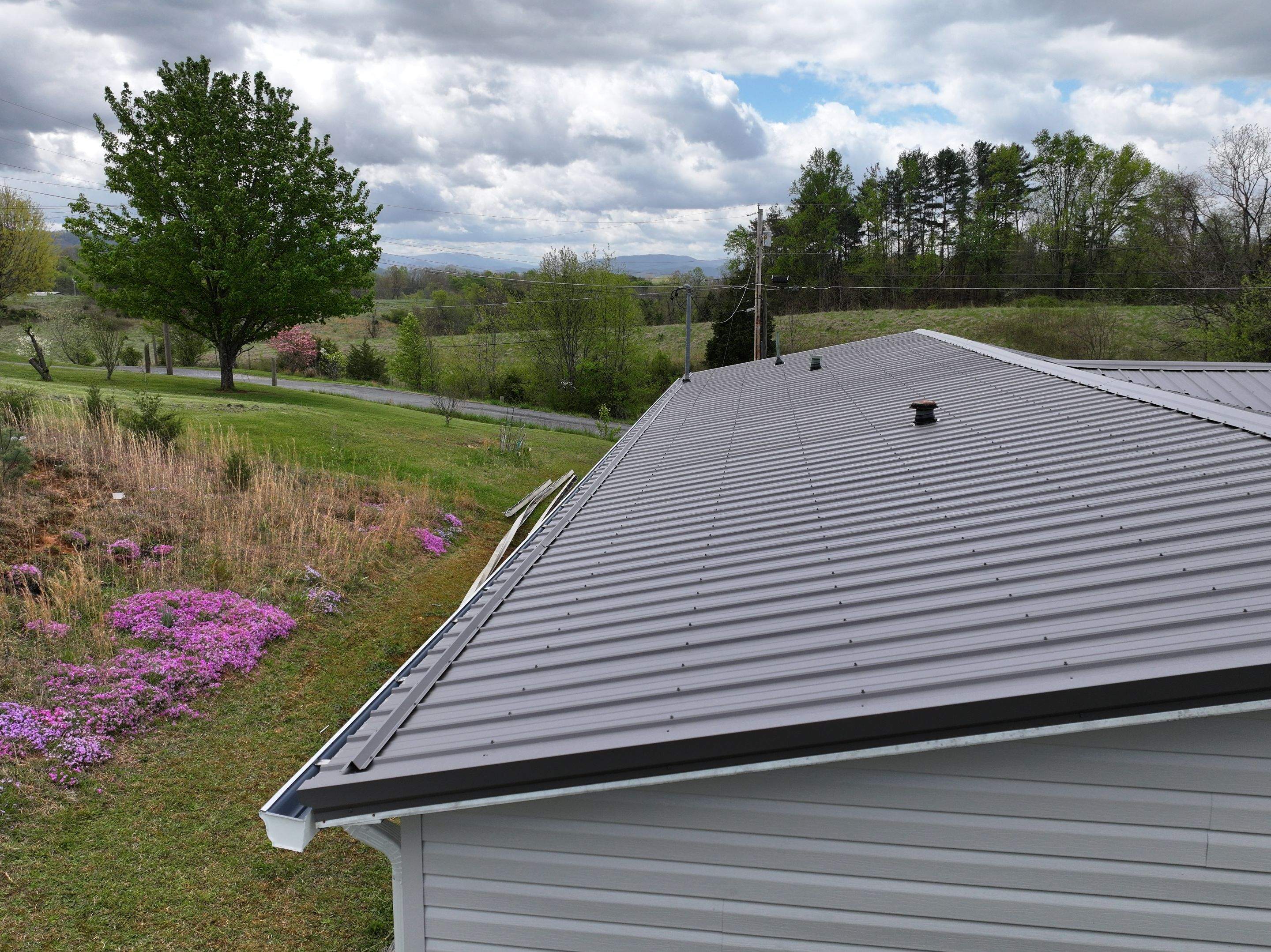Charcoal Gray Textured Metal Roof by Omnia Roofing