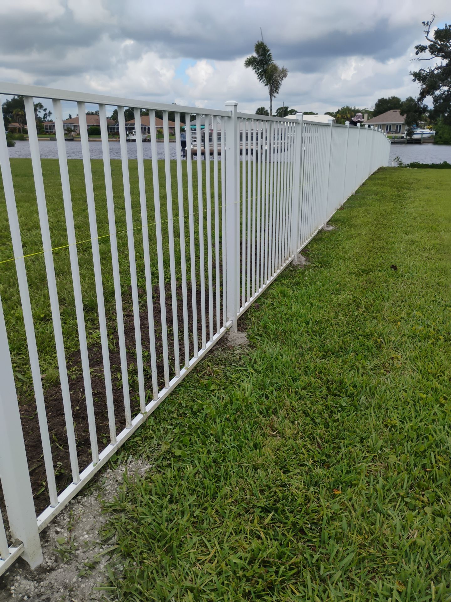 White Aluminum Picket Fence Installation for Port Charlotte Waterfront Home by True Fence LLC