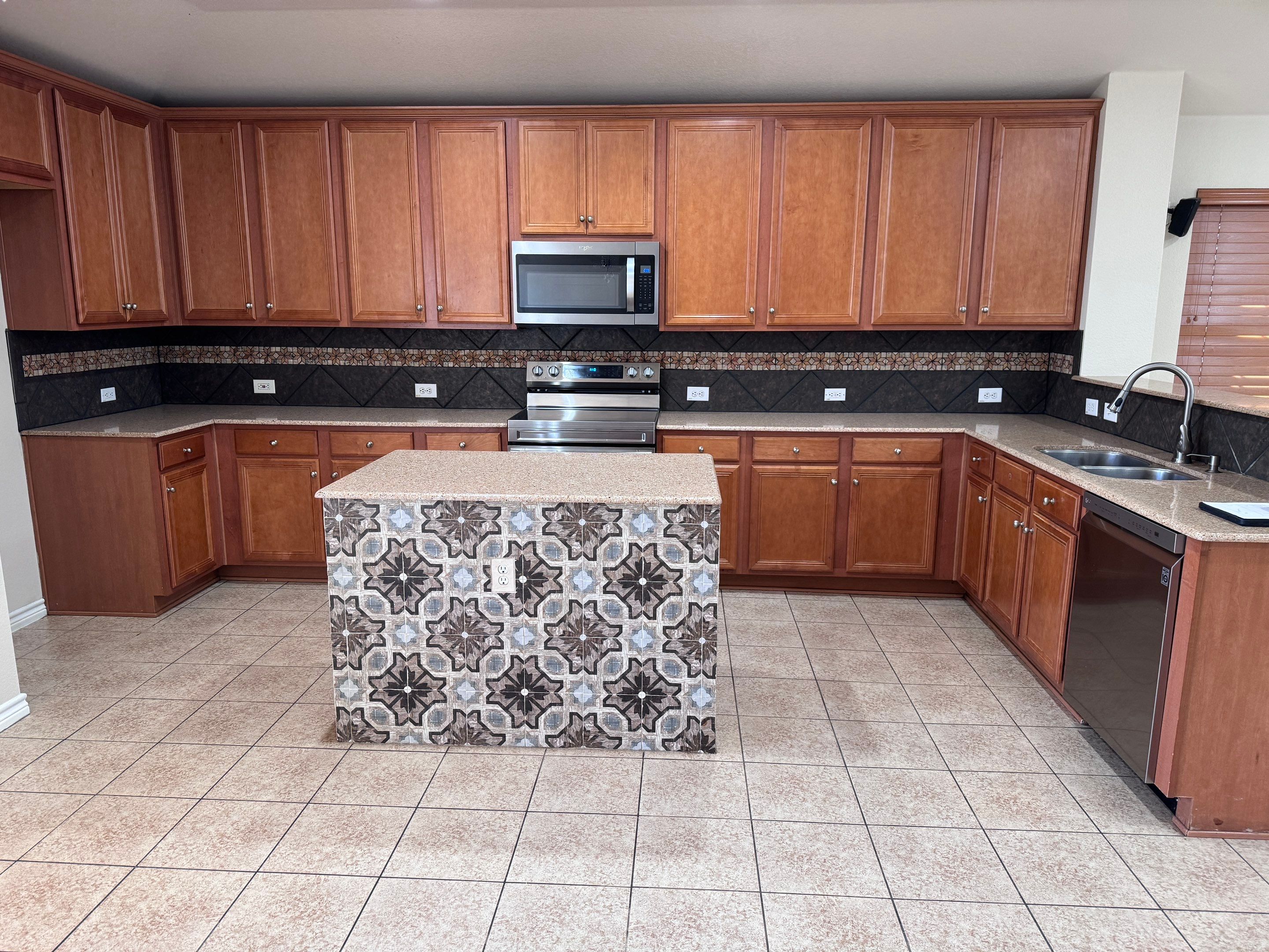 Luxury Focal Point: Full Kitchen Remodel with Double Waterfall Island by Tibi Soli LLC