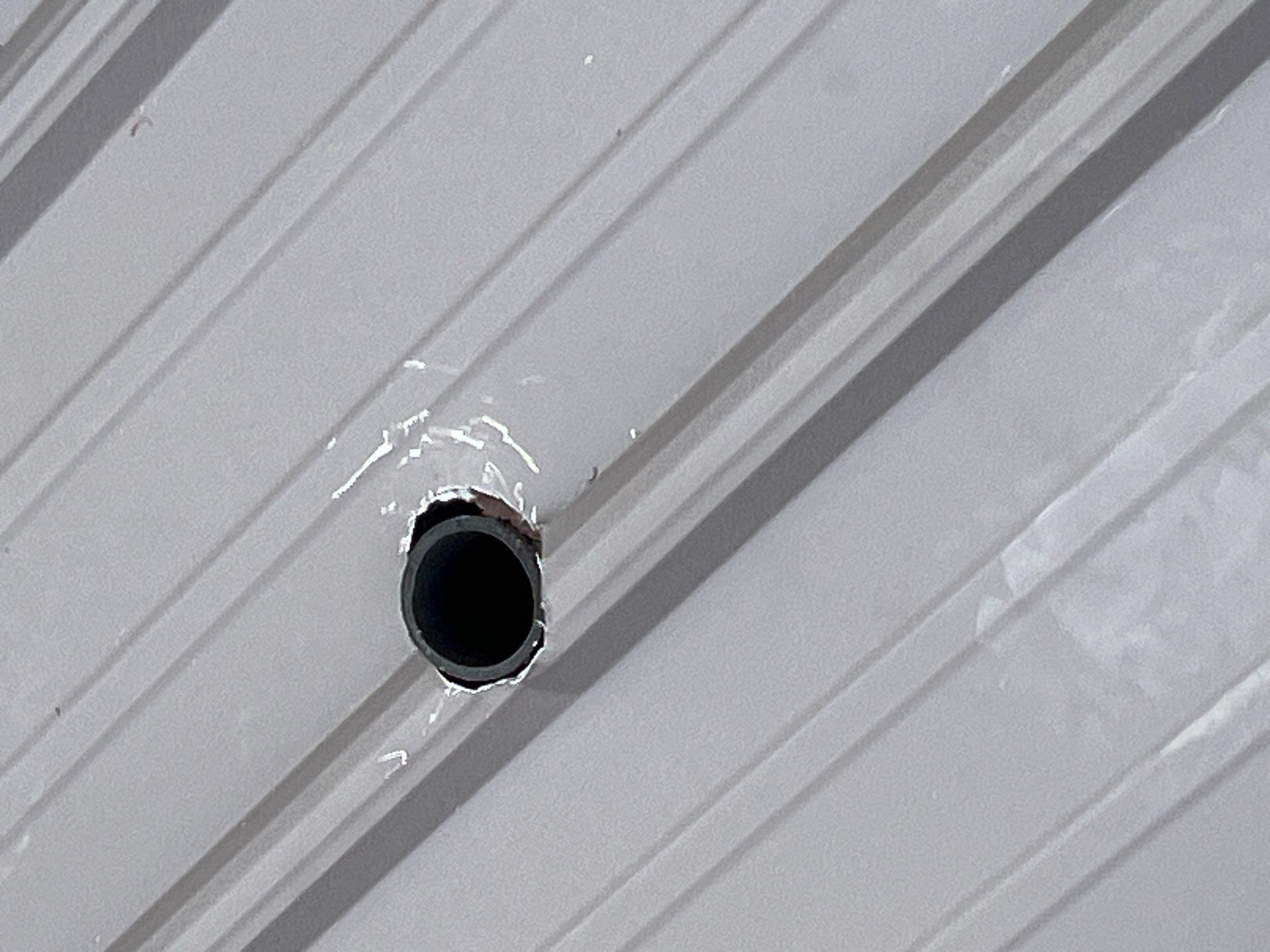 Textured Charcoal Gray using 29 Gauge AG Panel by Omnia Roofing