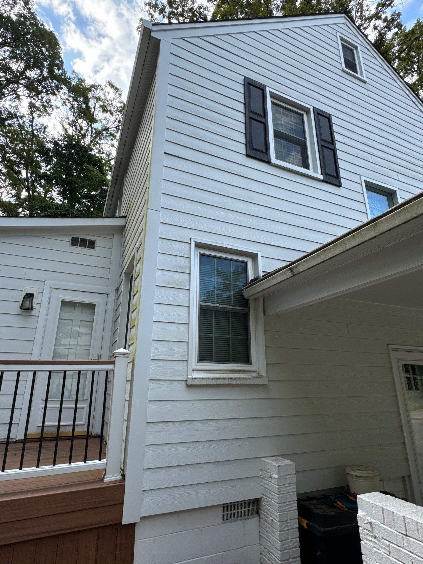 pressure washing company is cleaning house siding windows and porch in winston salem nc