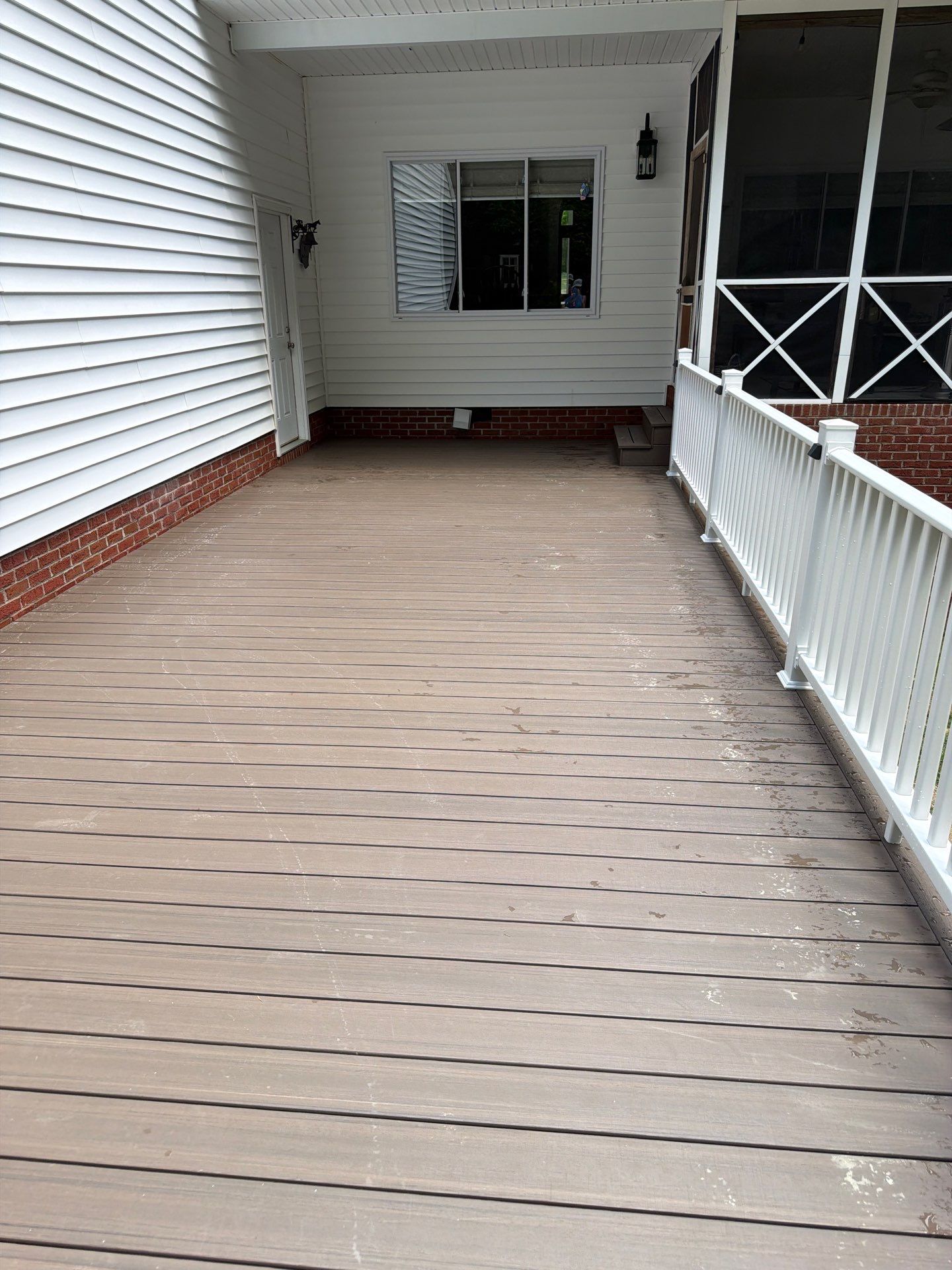 Custom Composite Deck and White Vinyl Railing Installation in Fayetteville by Walnut Hollow Decks & Outdoor Living