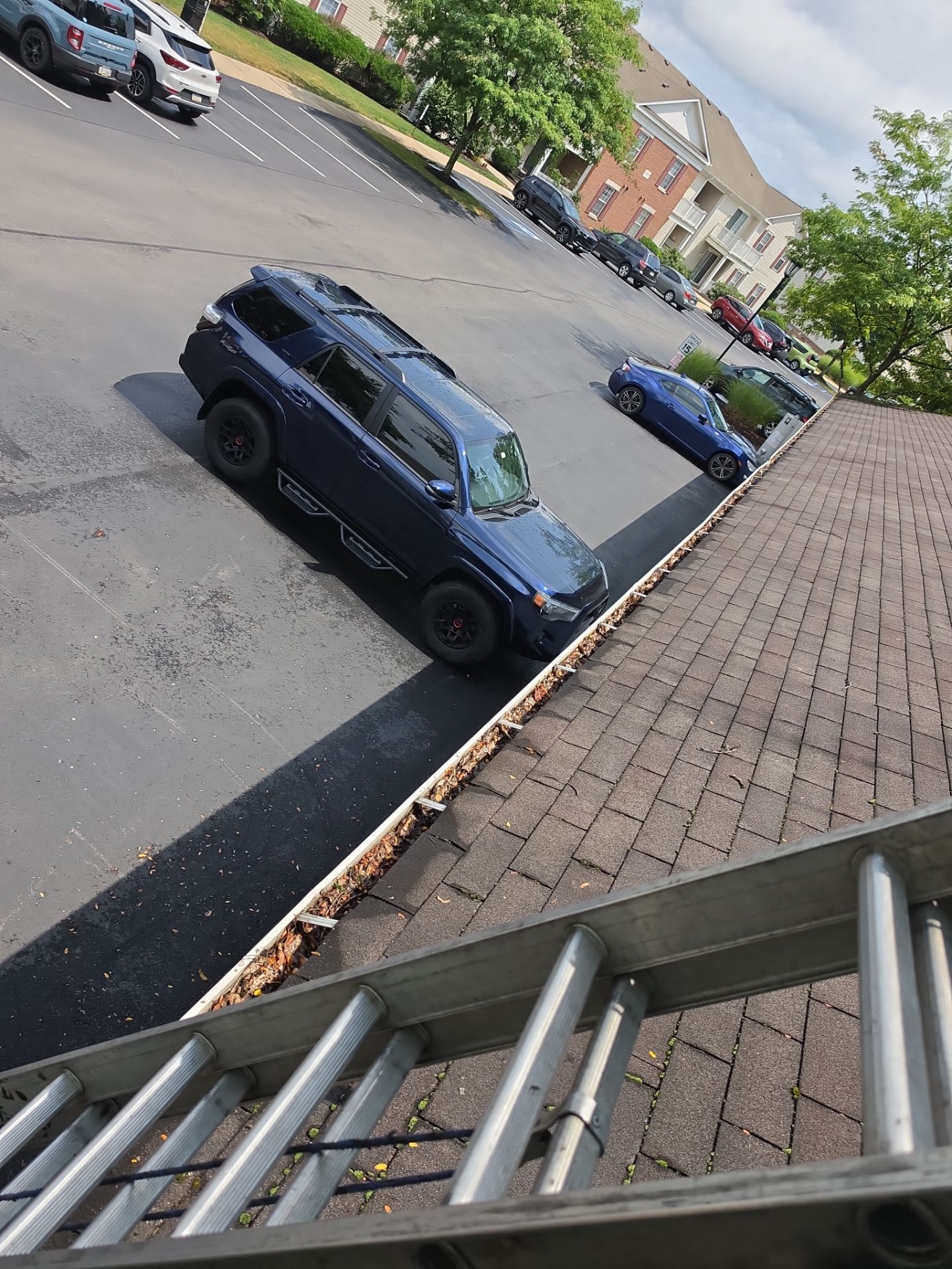 Commercial gutter cleaning Youngstown, OH before photo with filled gutters