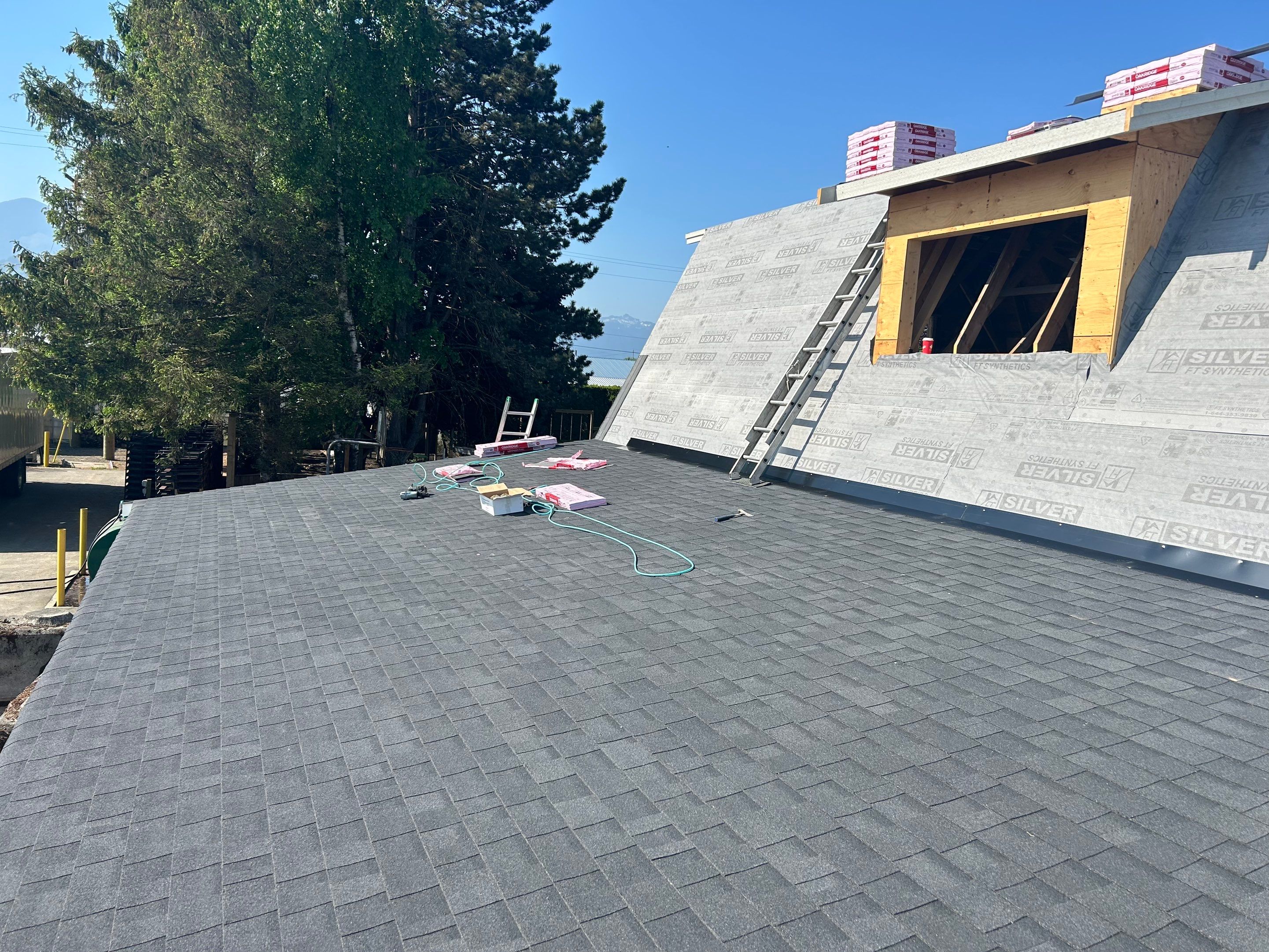 Residential Roofing Installation using OC Oakridge shingles by Top Notch Roofing Inc