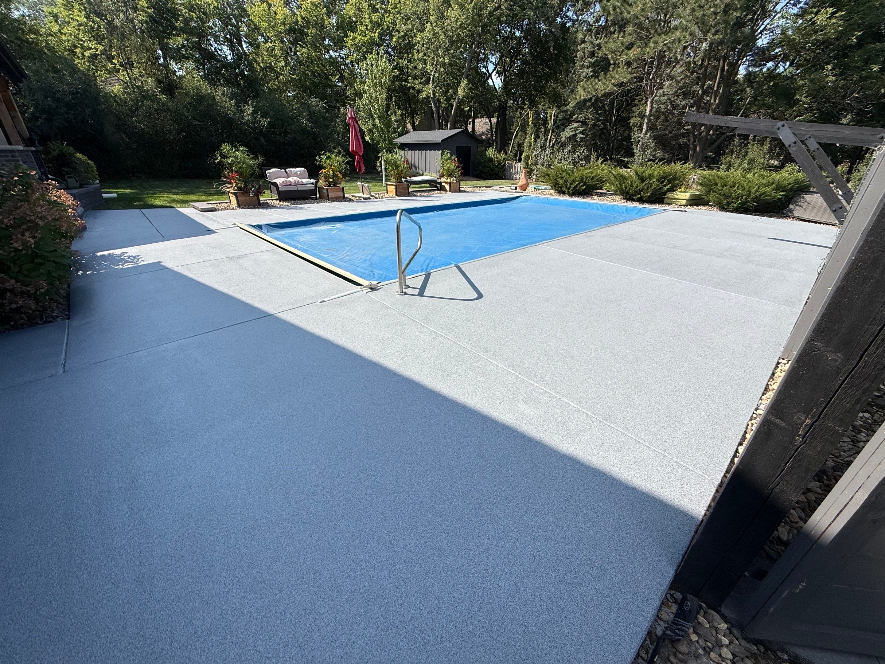 Garage Floor and Textured Pool Deck Coating in Sioux Falls by Select Painting, Coatings & Garage Cabinets