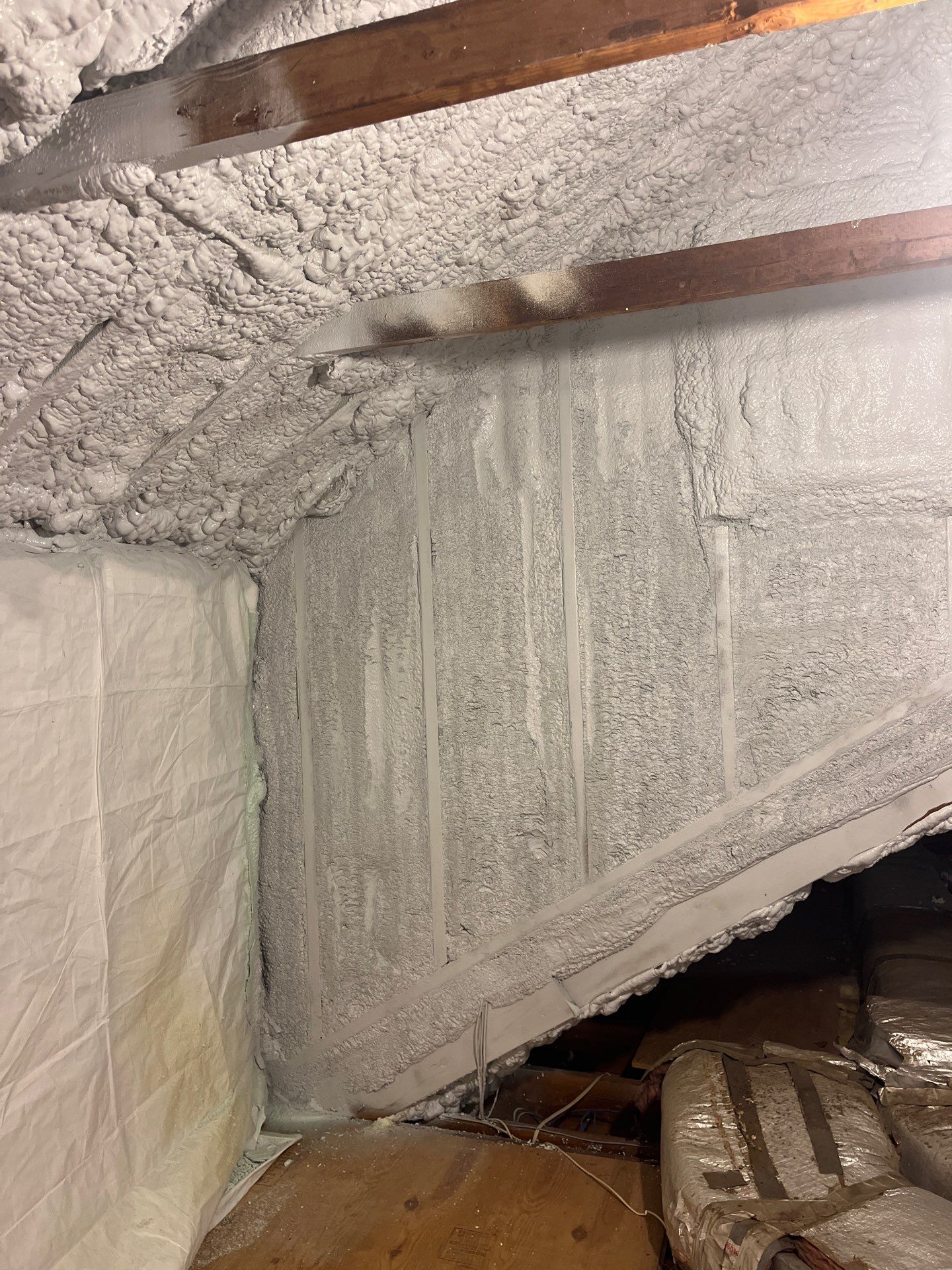 Attic Retrofit using open cell spray foam by NYS Foam & Energy
