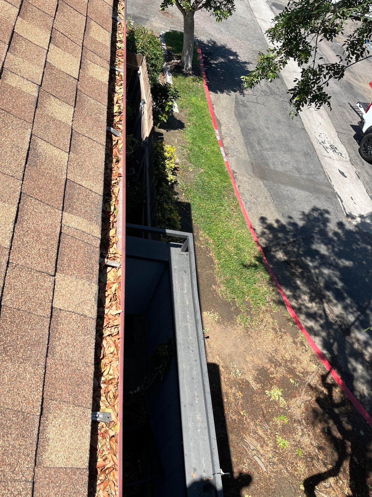 Commercial gutter cleaning Riverside, CA	 before photo with filled gutters