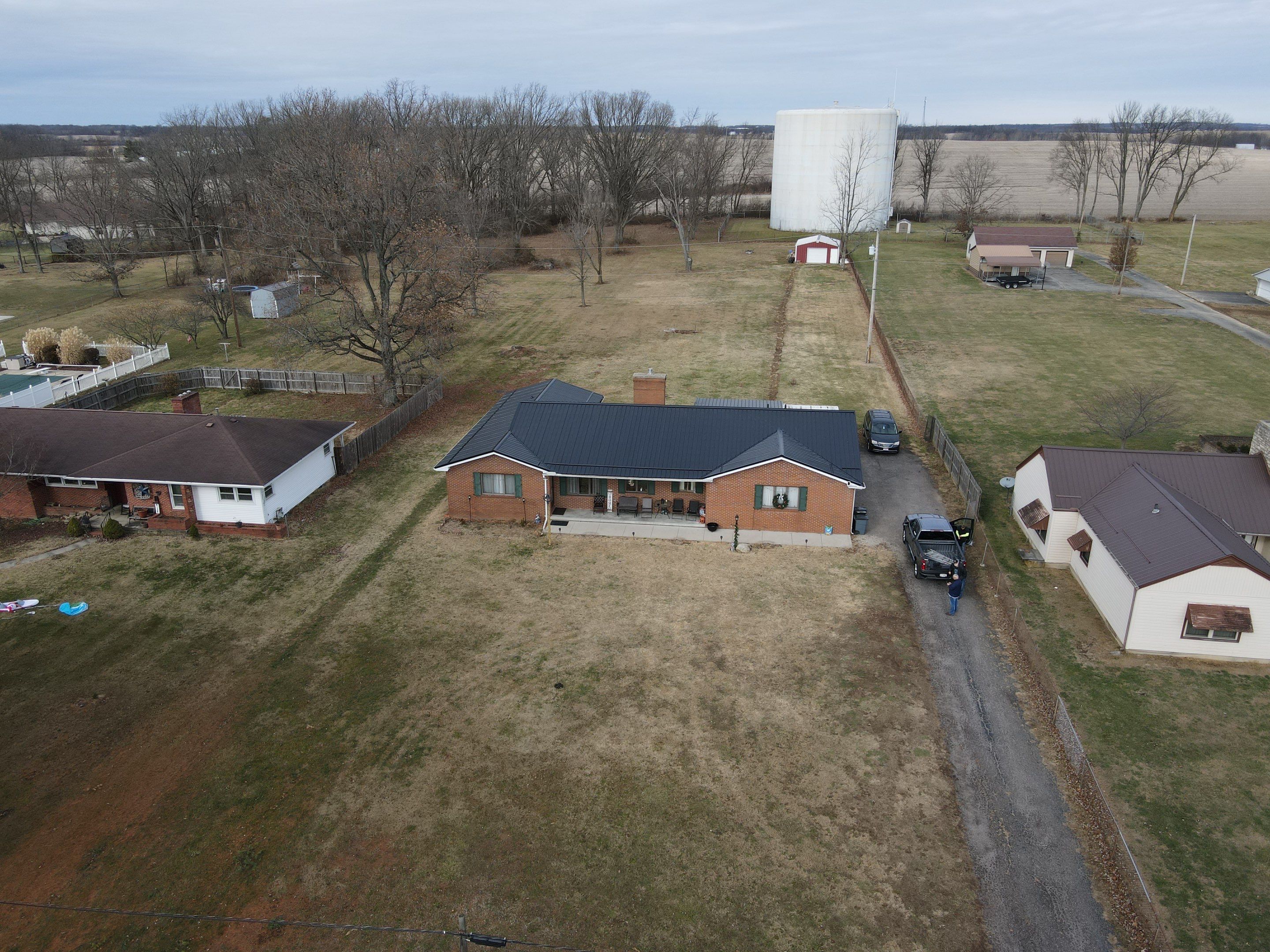 Residential Roofing Installation using Perfromance Panel Metal - Black by RoofX 