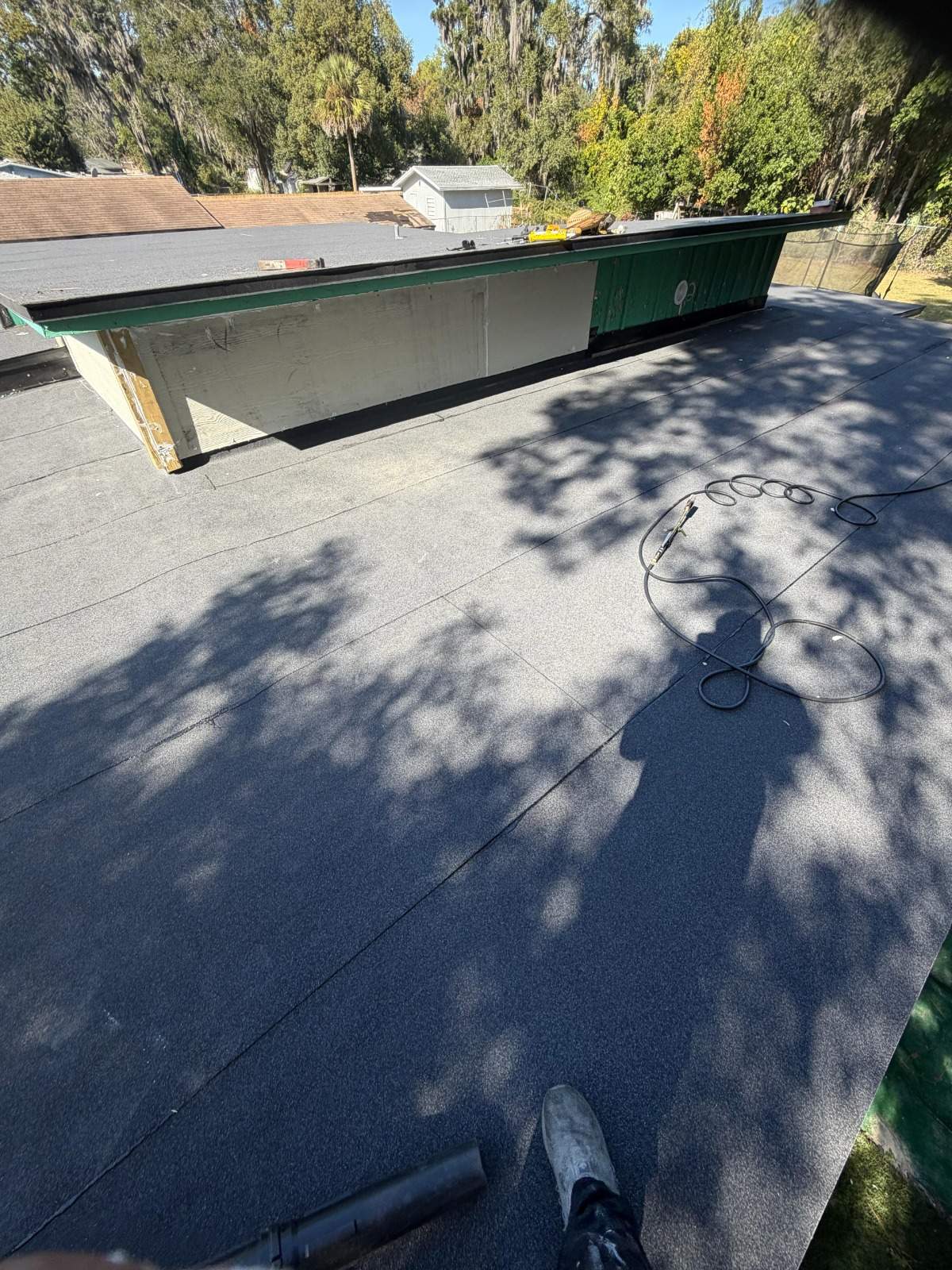 Flat Roof Renovation Due to Water Accumulation by urban green energy llc
