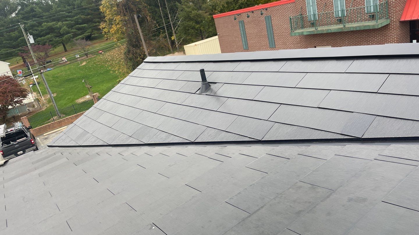 Tesla Solar Roof on a Commercial Building by American Home Contractors