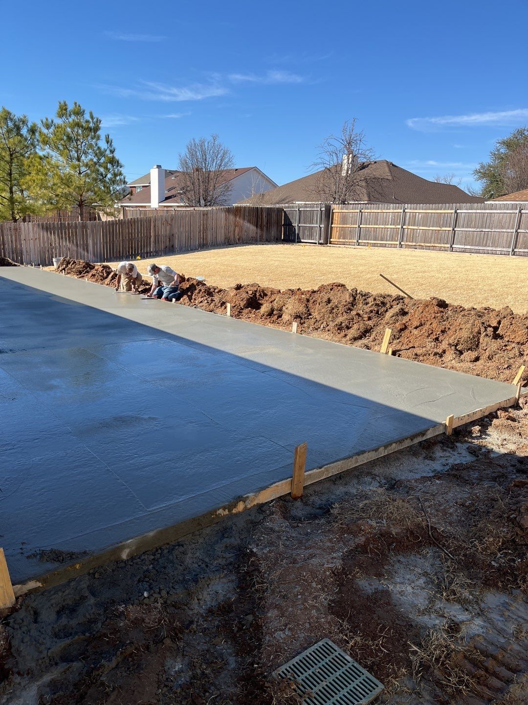 Concrete Slab , Retaining Wall , Fence, and landscape. by Clays Services Inc